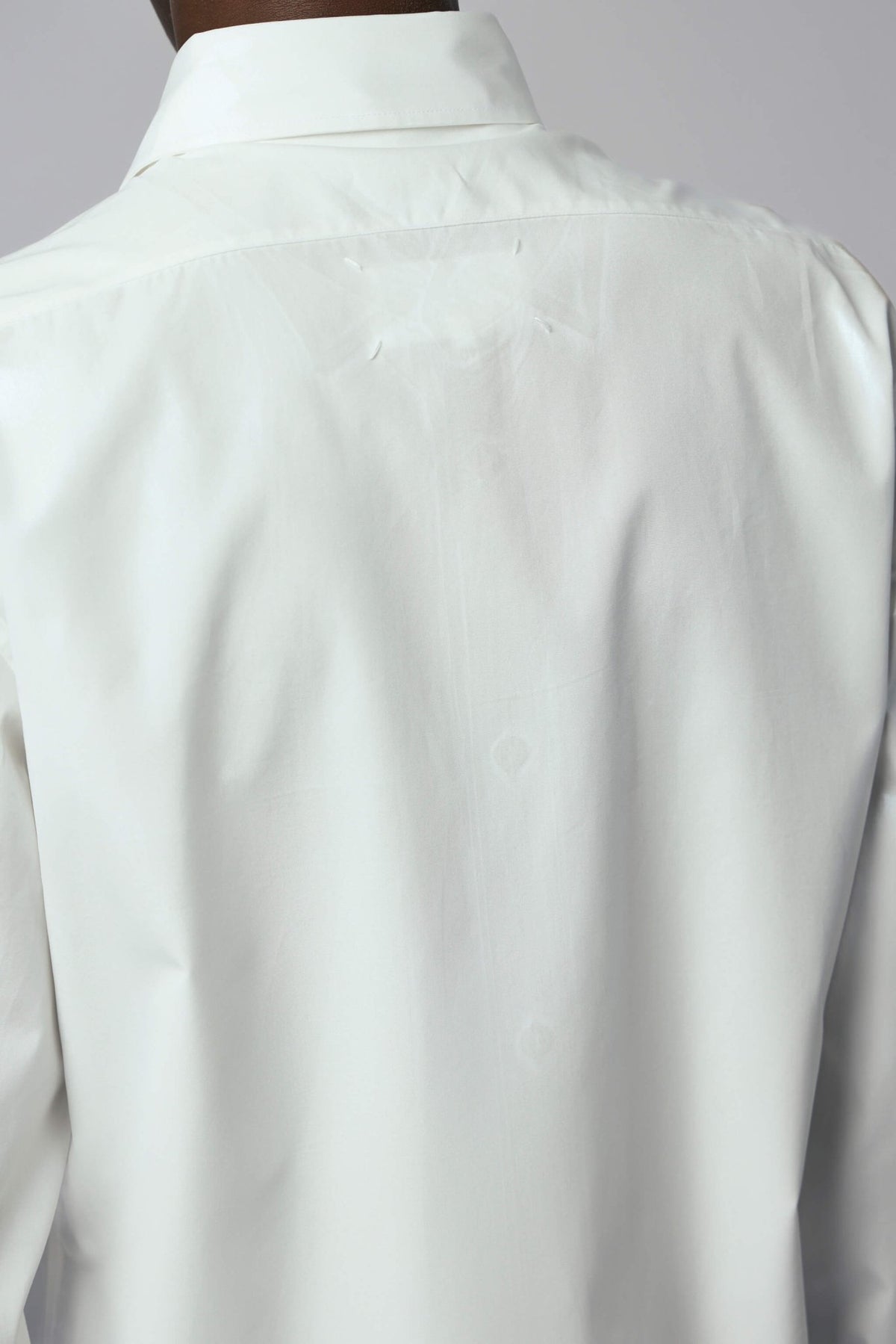Back view of Maison Margiela dress shirt showing straight hem and premium construction