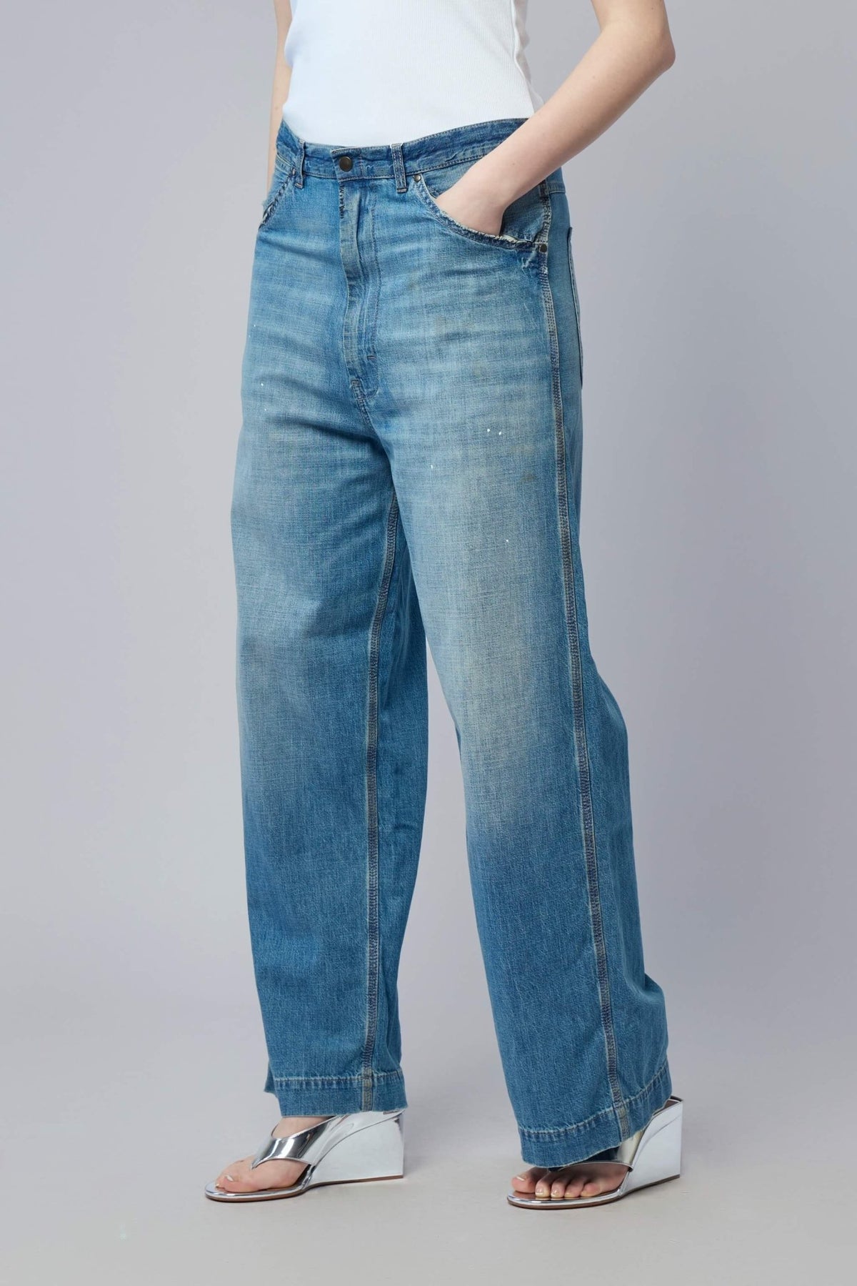 Close-up detail of Maison Margiela wide leg jeans construction and premium cotton fabric