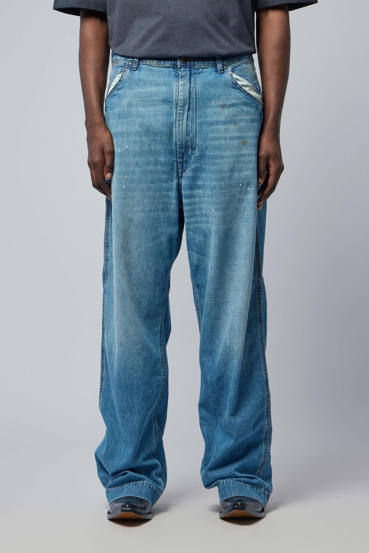 Side view of wide-leg cotton pants showing relaxed silhouette