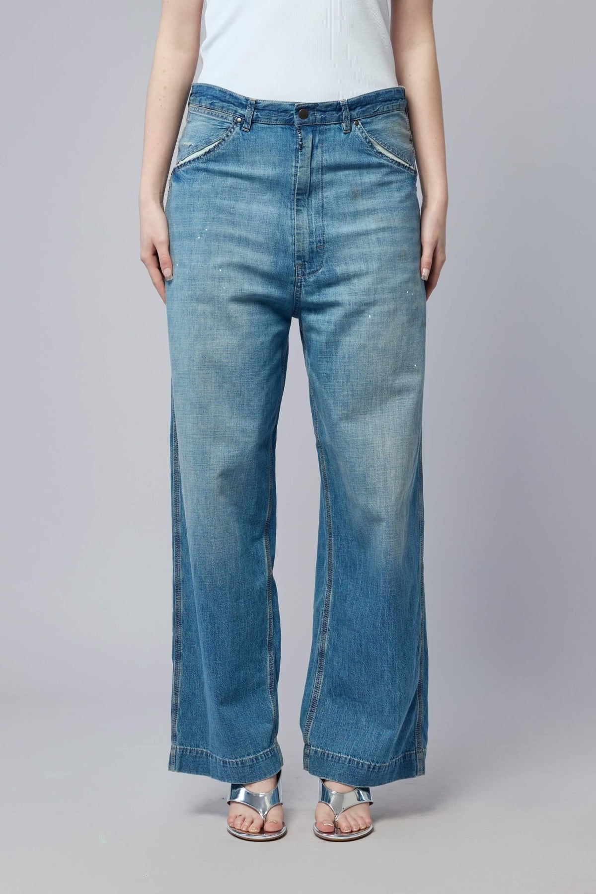 Model wearing Maison Margiela wide leg jeans showing the flowing silhouette and true-to-size fit