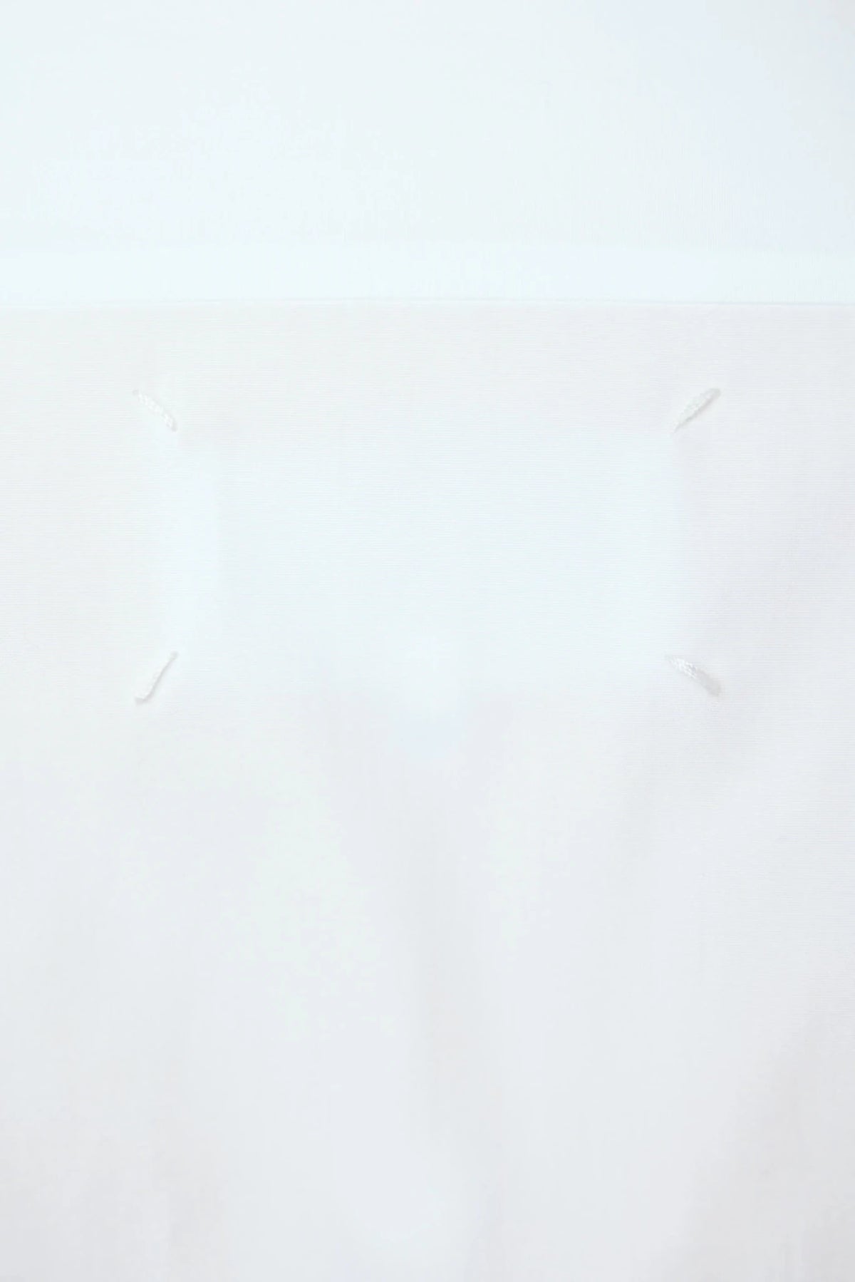 Detail shot of cotton fabric texture on Margiela blouse