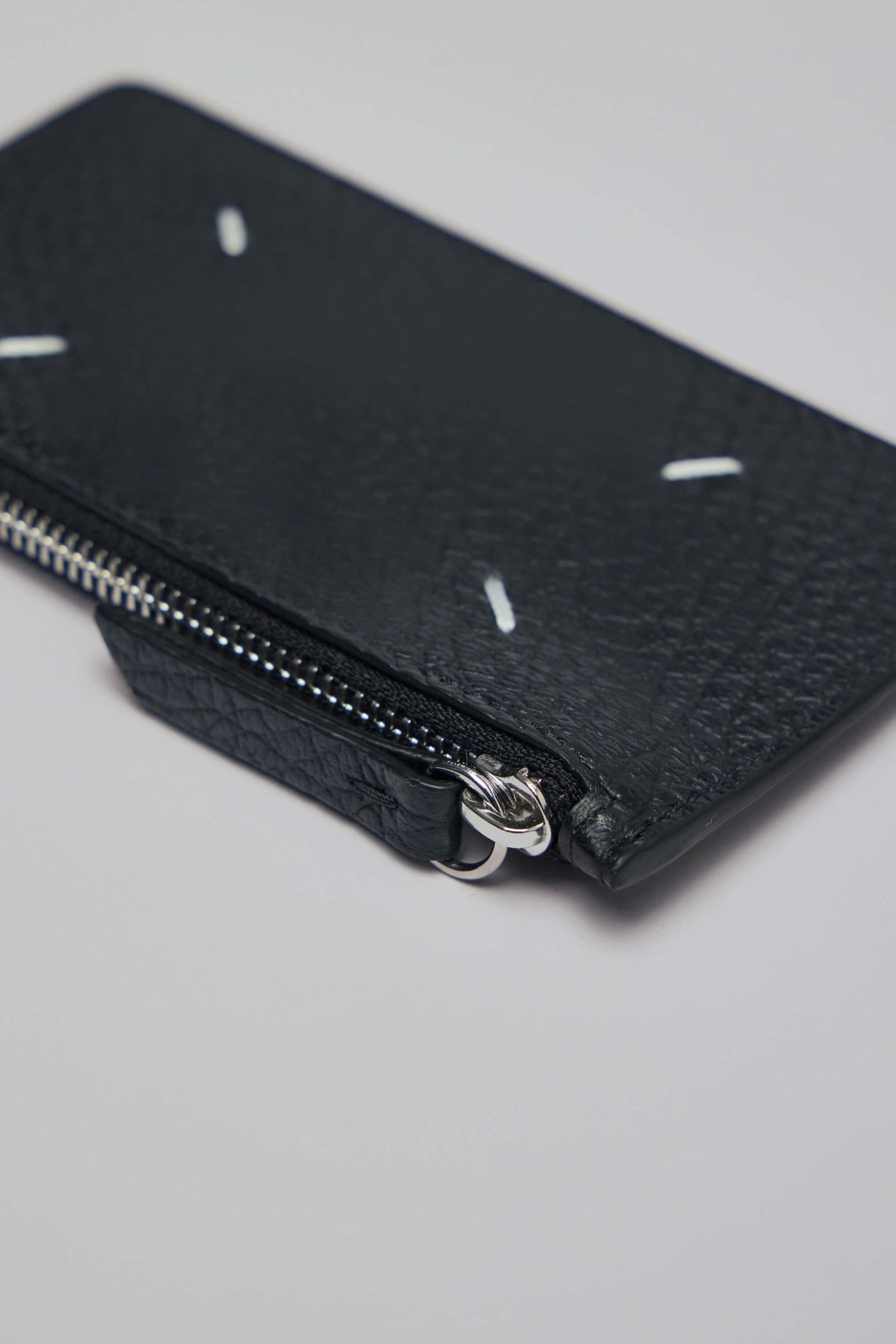Maison Margiela black leather cardholder with signature white stitching accents