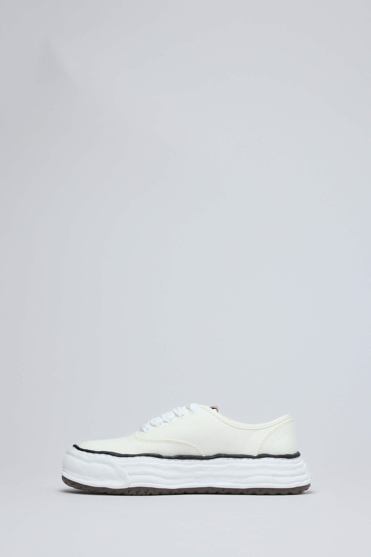Close-up of cotton upper texture and rubber sole construction