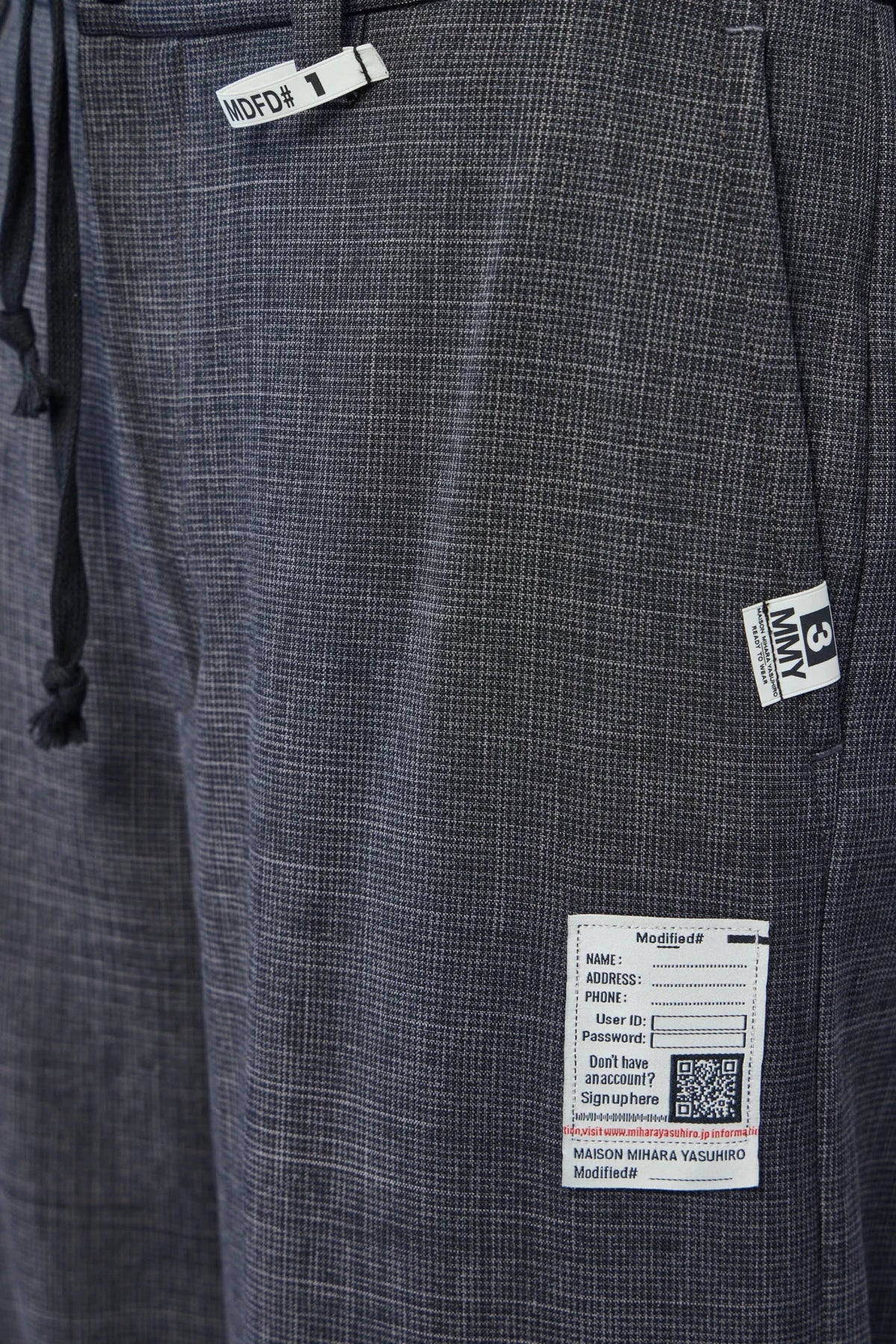 Back view of Maison Mihara Yasuhiro Wide-Leg Pants showing pocket design