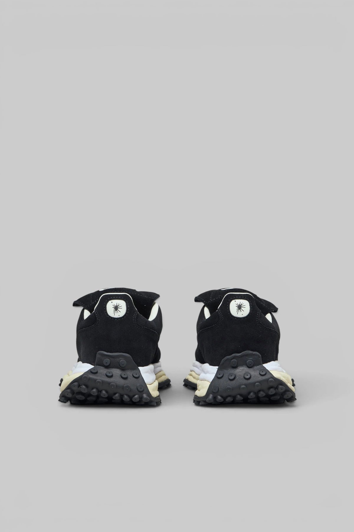 Close-up of white laces and beige midsole on Maison Mihara Yasuhiro sneaker