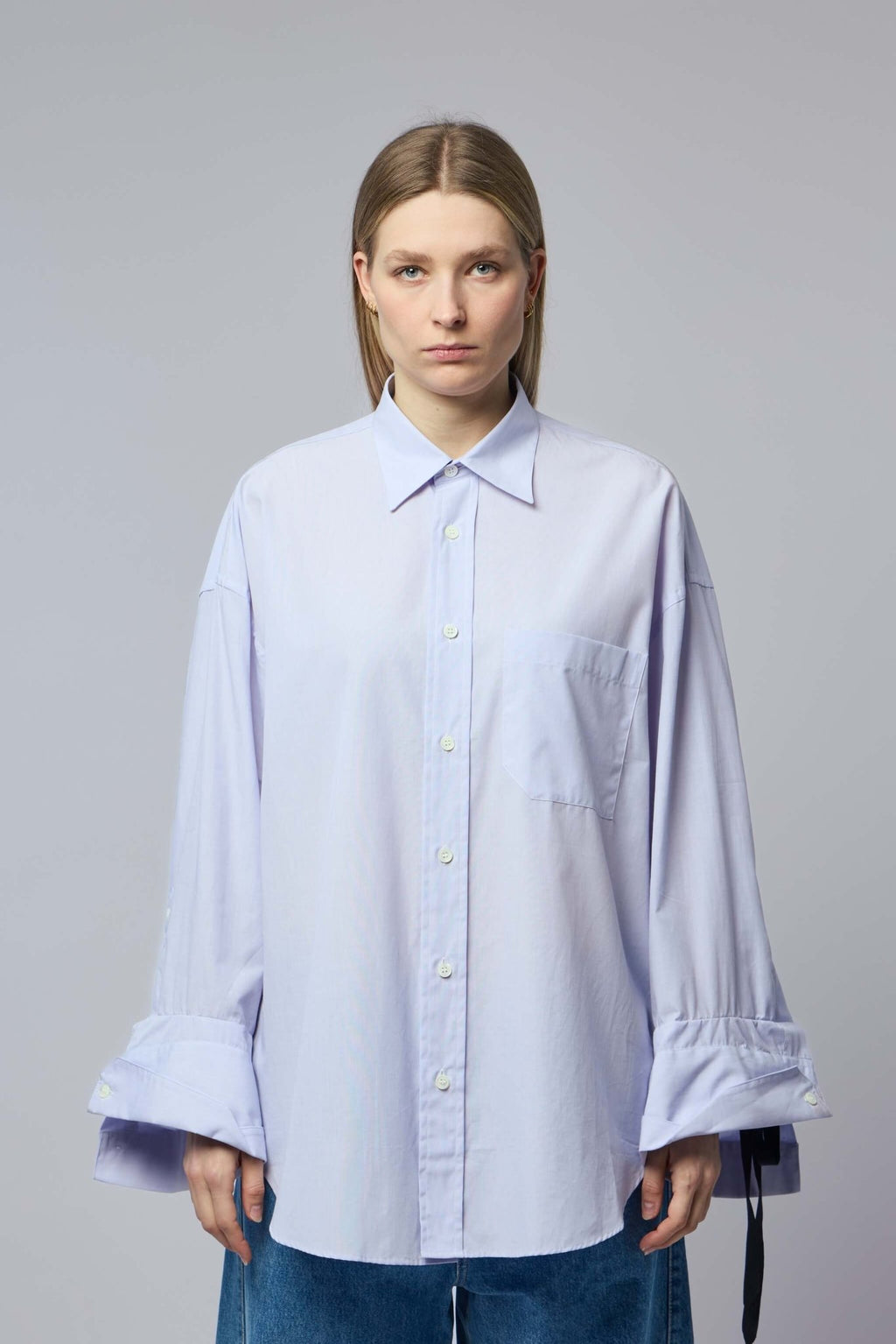 Marina Yee - Oversized Shirt - LABELS — Close-up view of oversized shirt chest pocket and button details