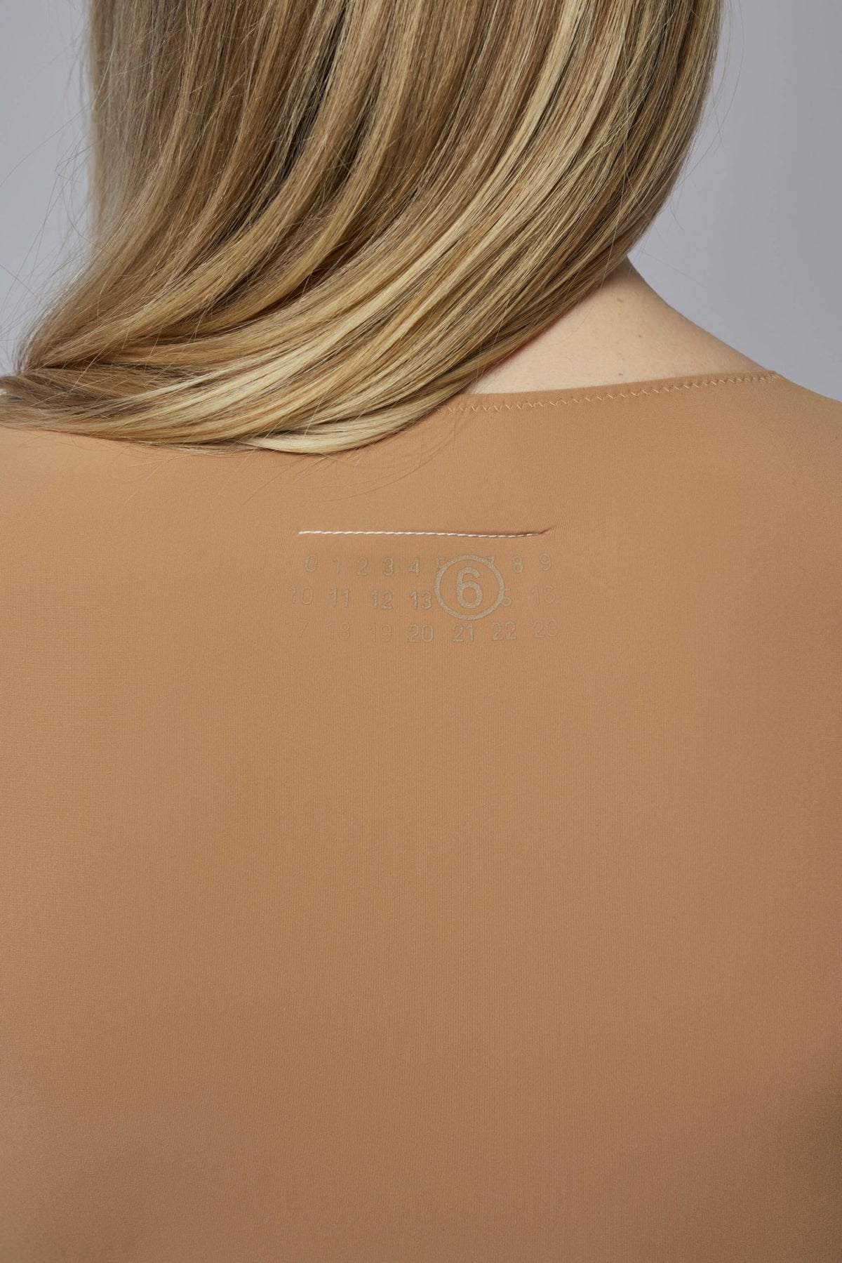 Back view of MM6 Margiela bodysuit showing seamless construction, view 5