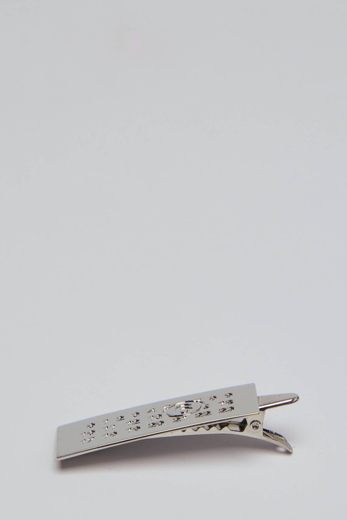 MM6 Margiela hair accessory showing solid back clip mechanism