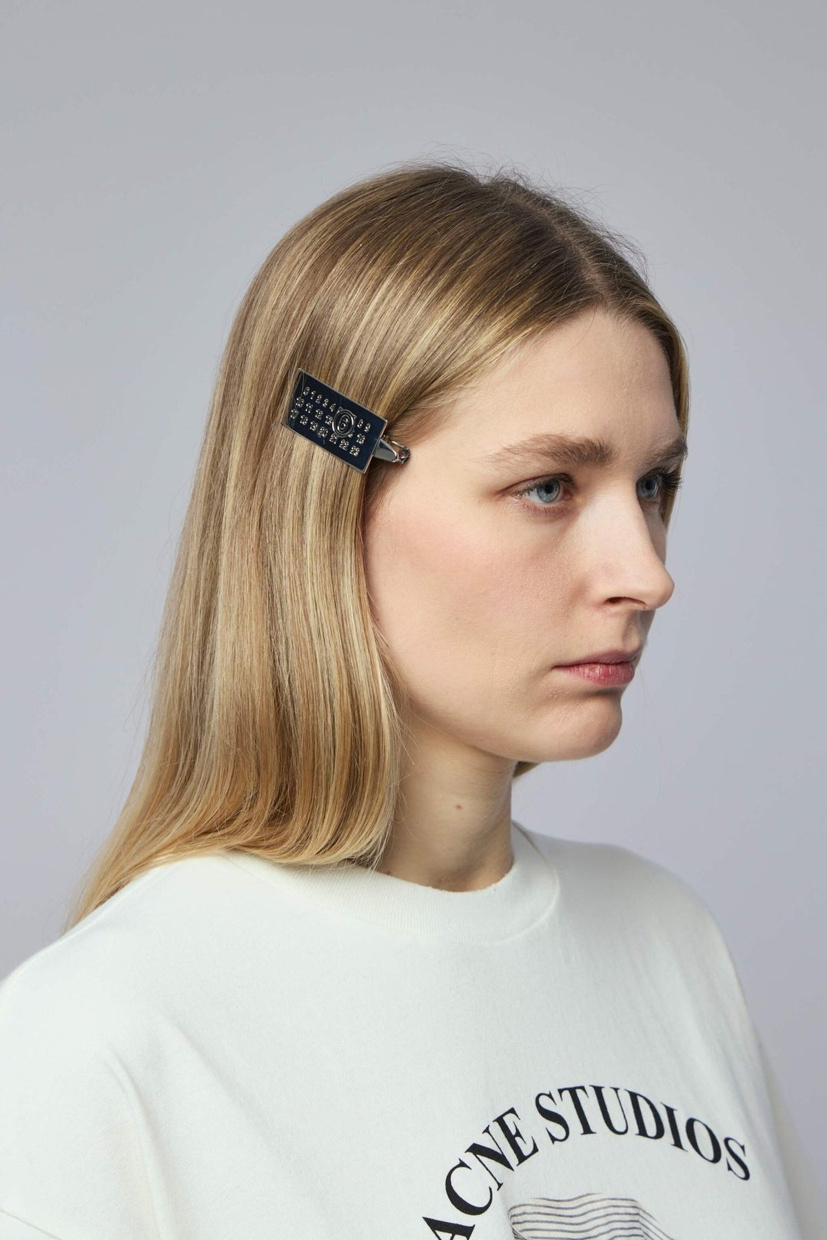 Luxury hair clip with shiny metallic surface and compact design