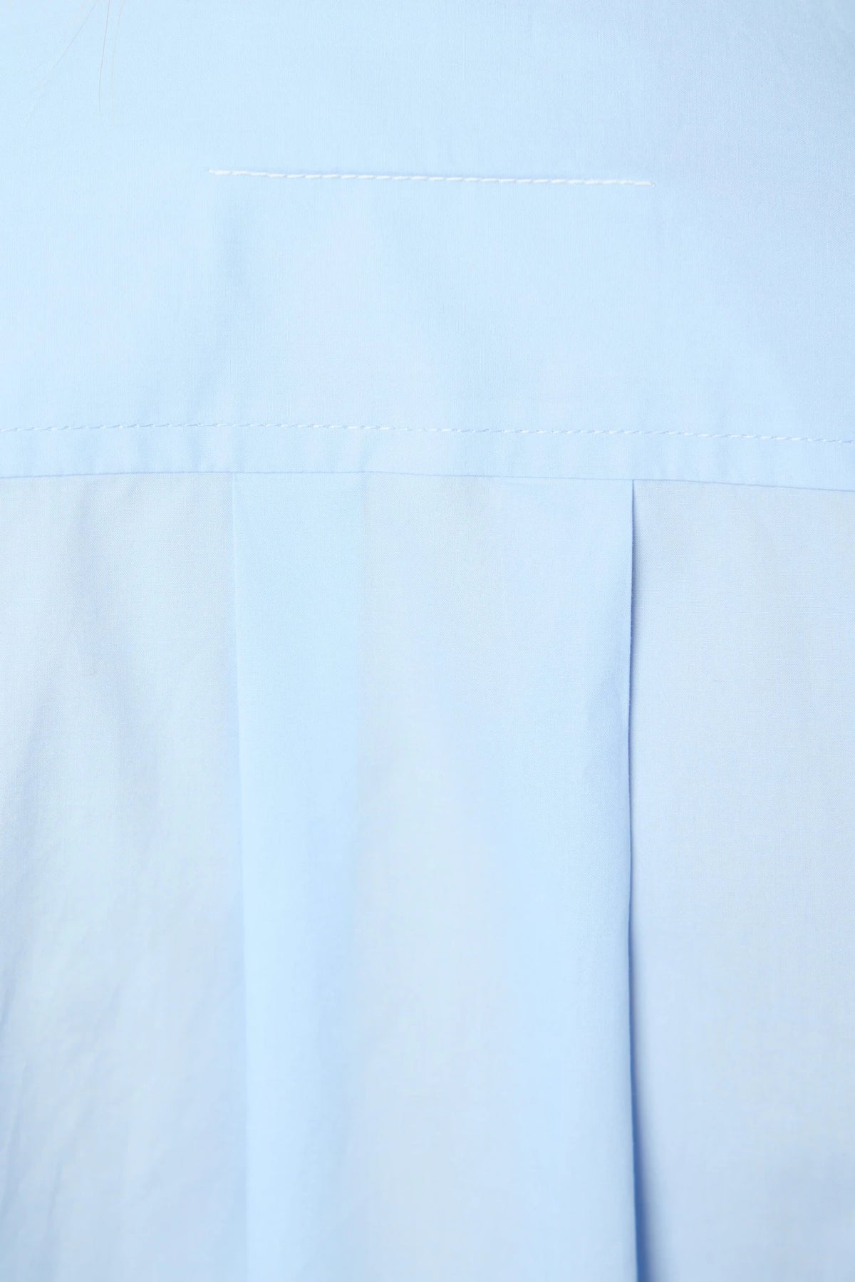 MM6 Margiela long-sleeved shirt worn open over layering piece