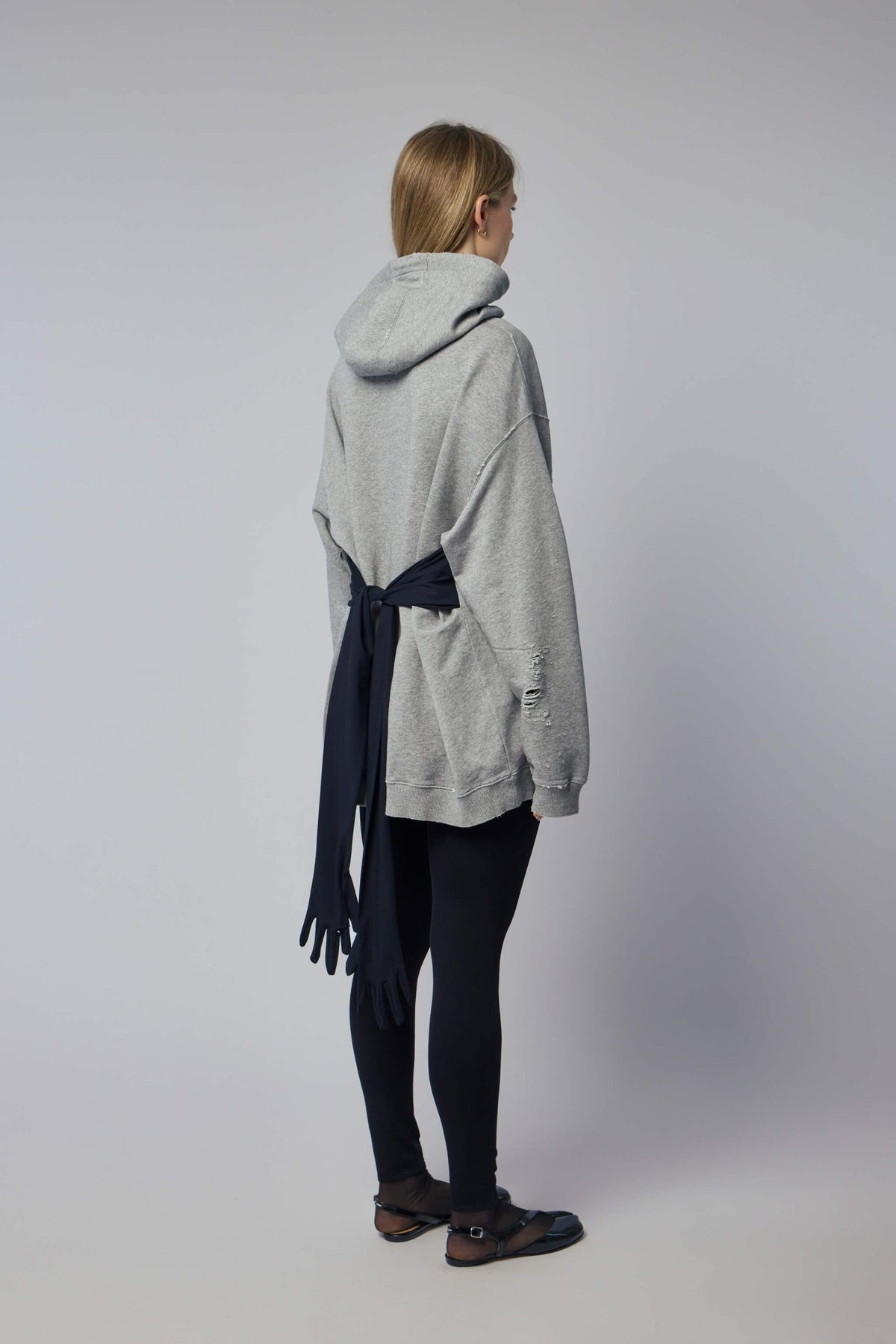Back view of MM6 Margiela mini dress showcasing minimalist silhouette