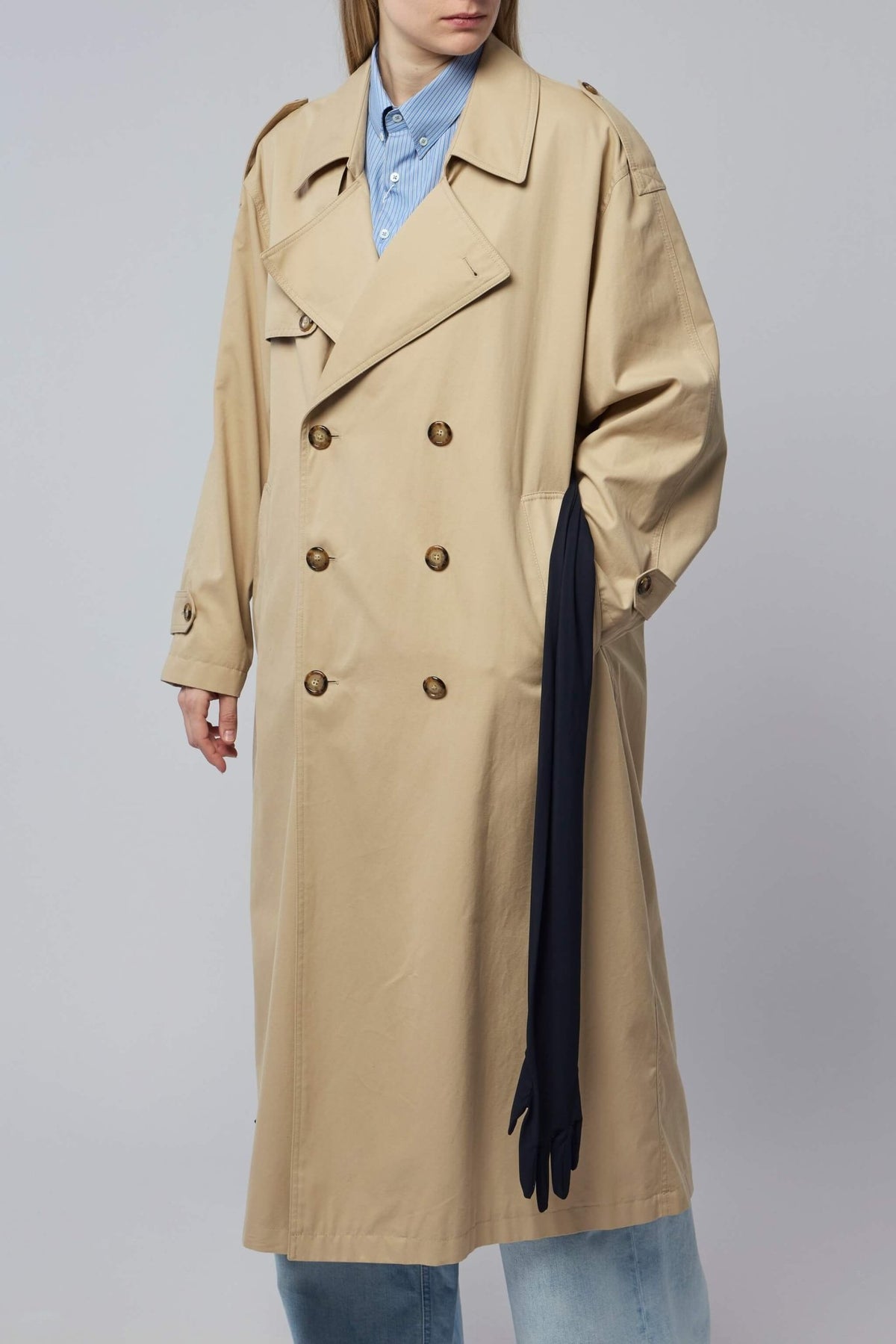 Model wearing MM6 Margiela trench coat showing true to size fit