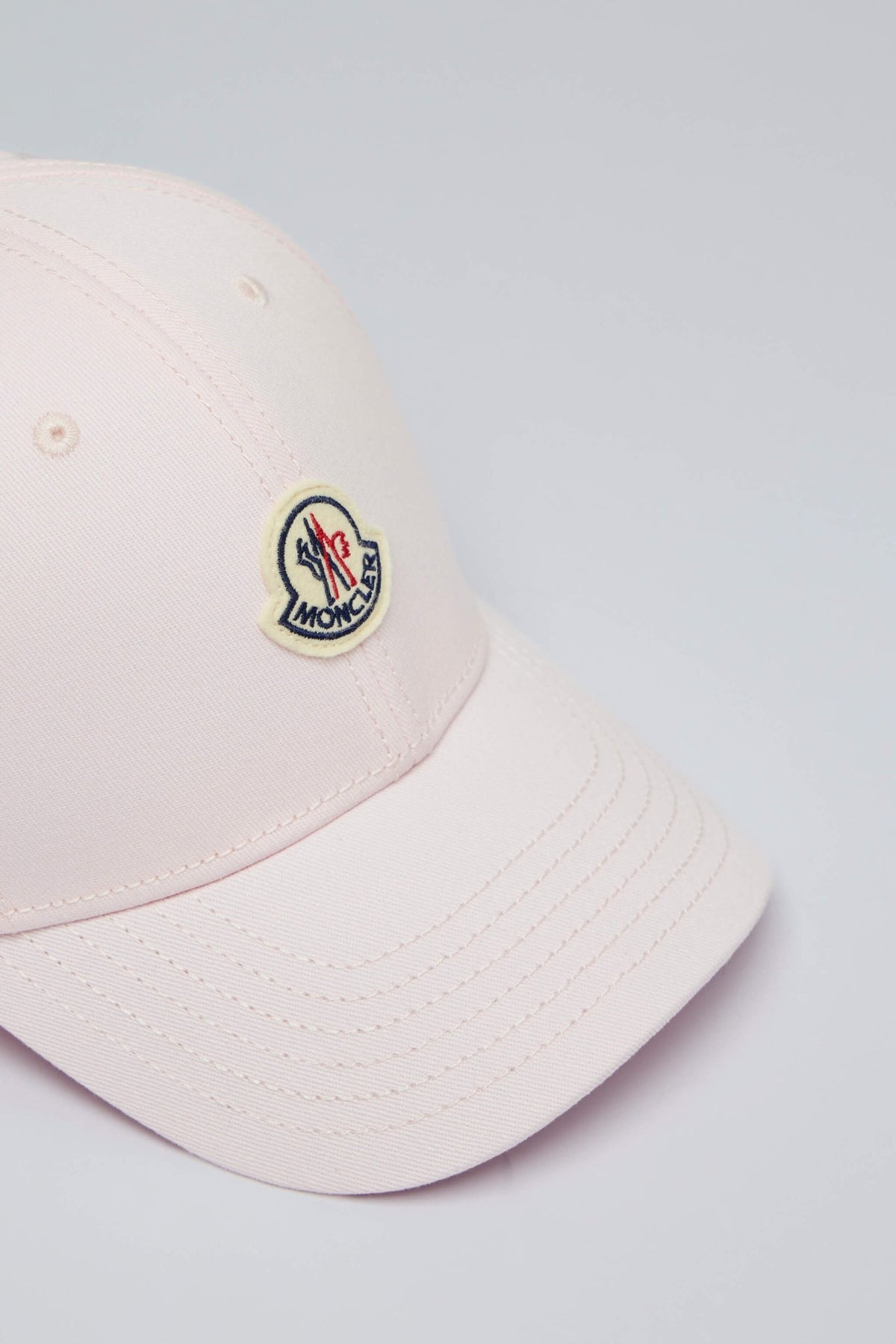 Close-up view of Moncler baseball cap showing quality construction