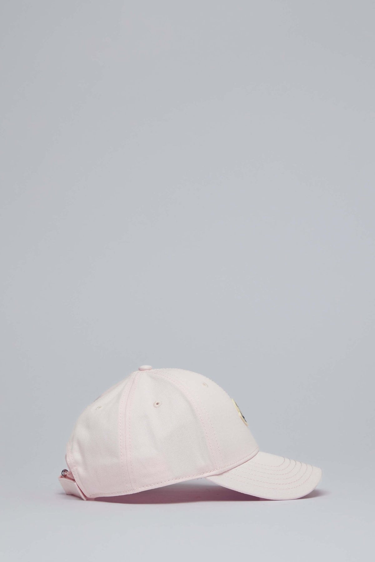Side profile of luxury baseball cap by Moncler
