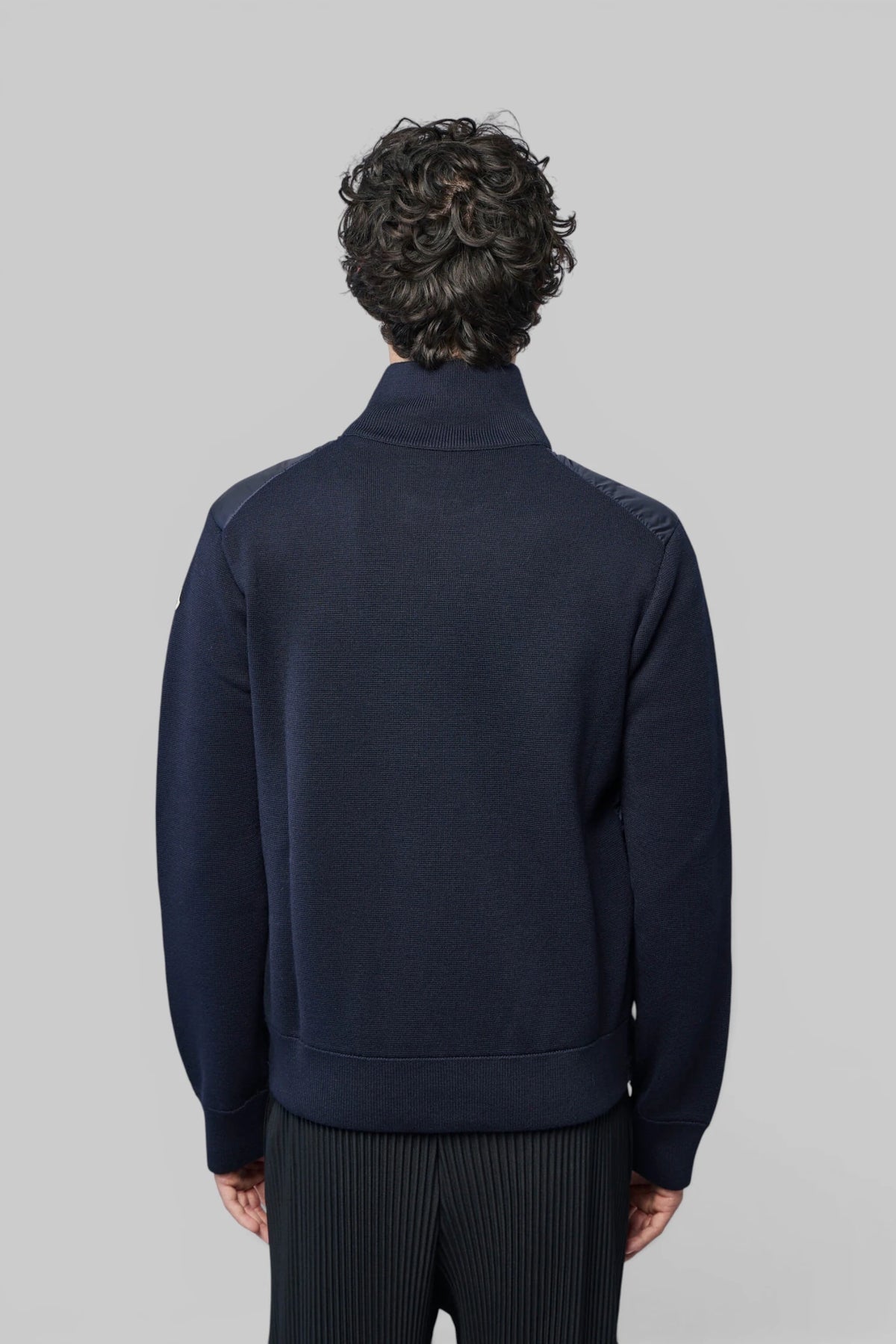 Moncler cardigan back view showing contrasting sleeve fabric