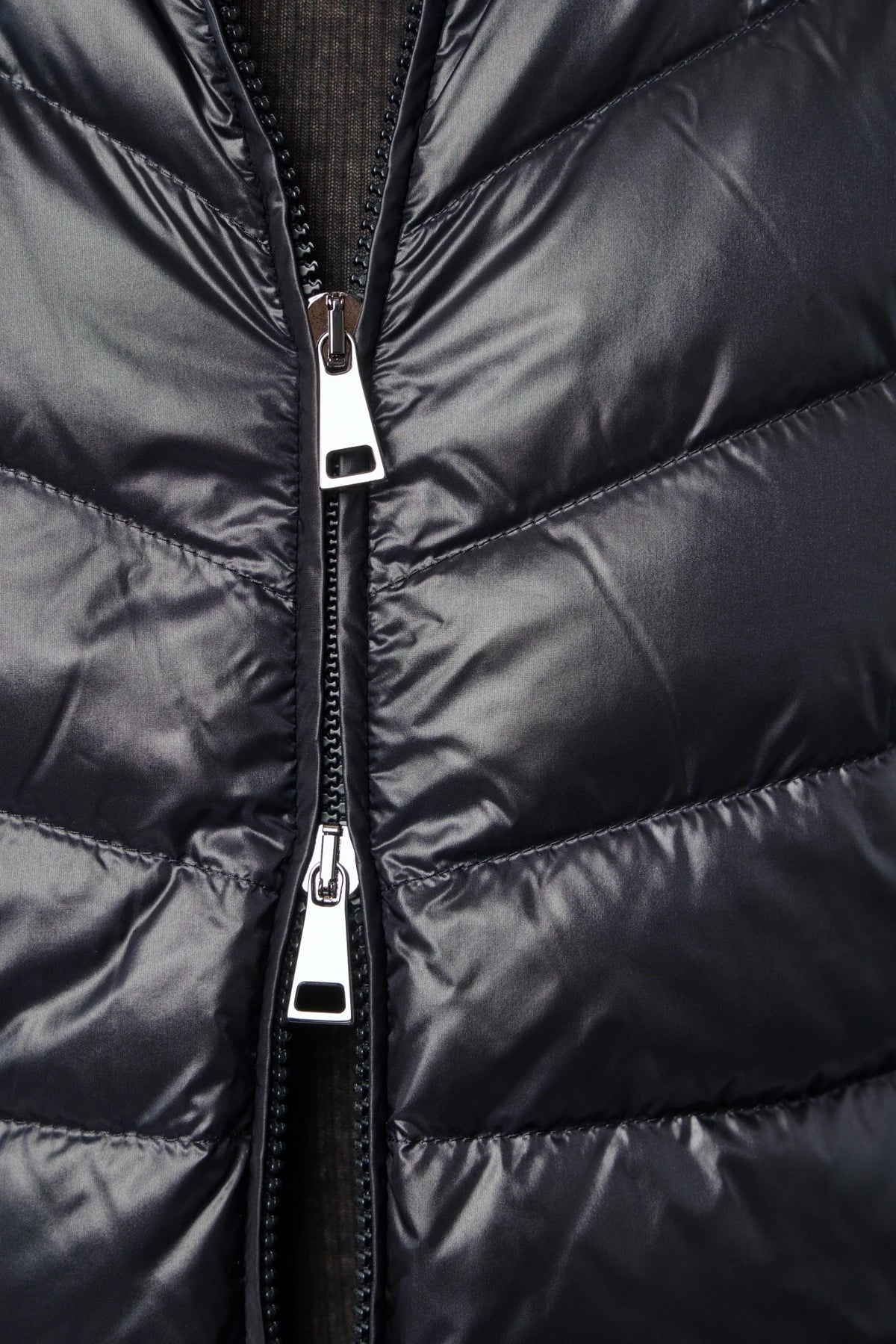 Back view of Moncler quilted vest silhouette