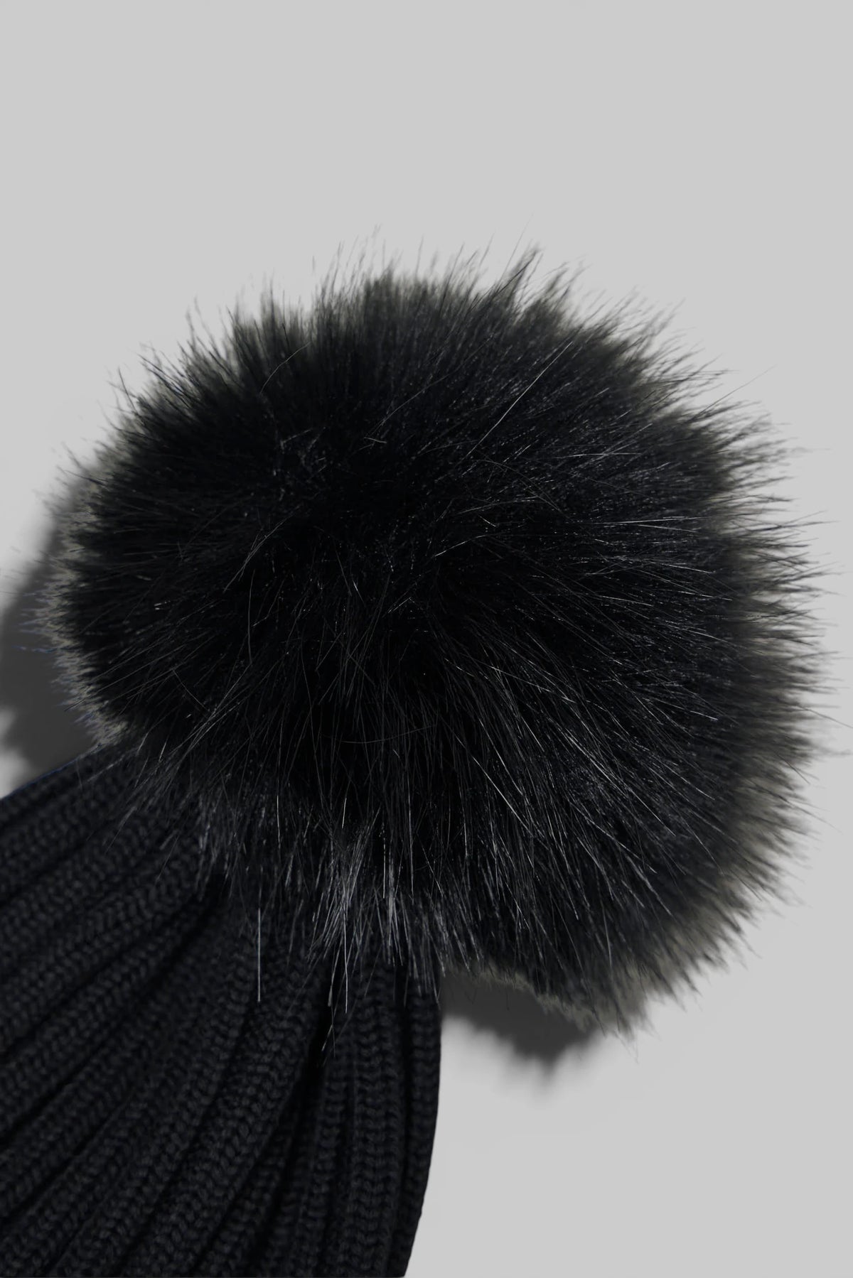 Moncler Beanies styled on model with winter outerwear
