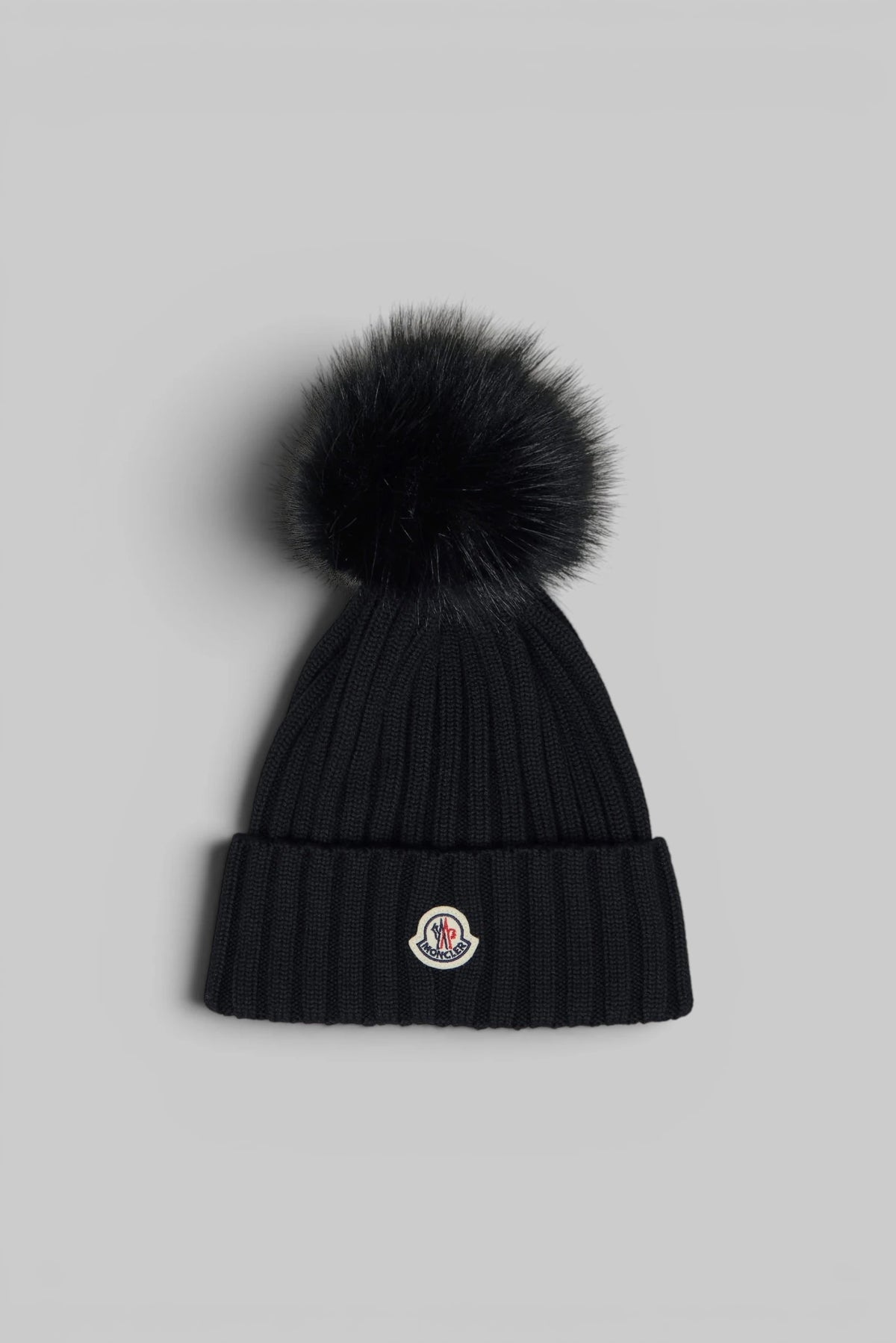 Moncler Beanies in black ribbed knit with pom-pom detail, front view