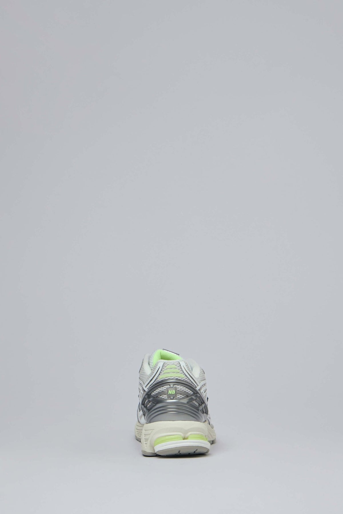 New Balance 1906R sneakers displaying reflective metallic accents