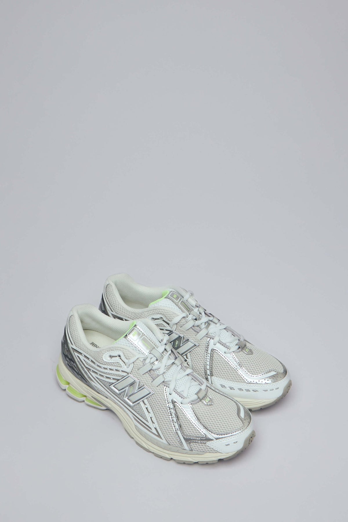 Side view of New Balance 1906R sneakers showing textured rubber outsole