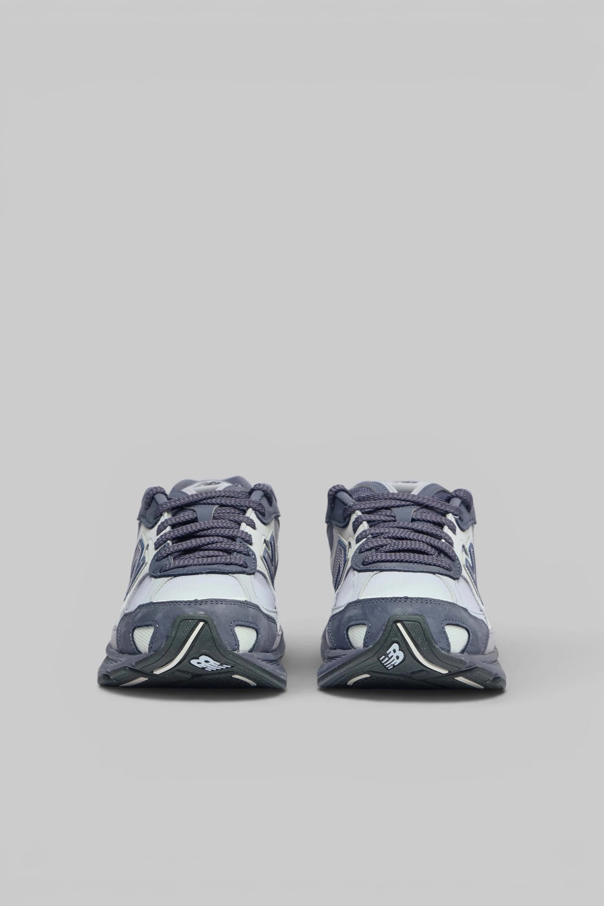 Side view of New Balance 2010 sneakers showing logo detail