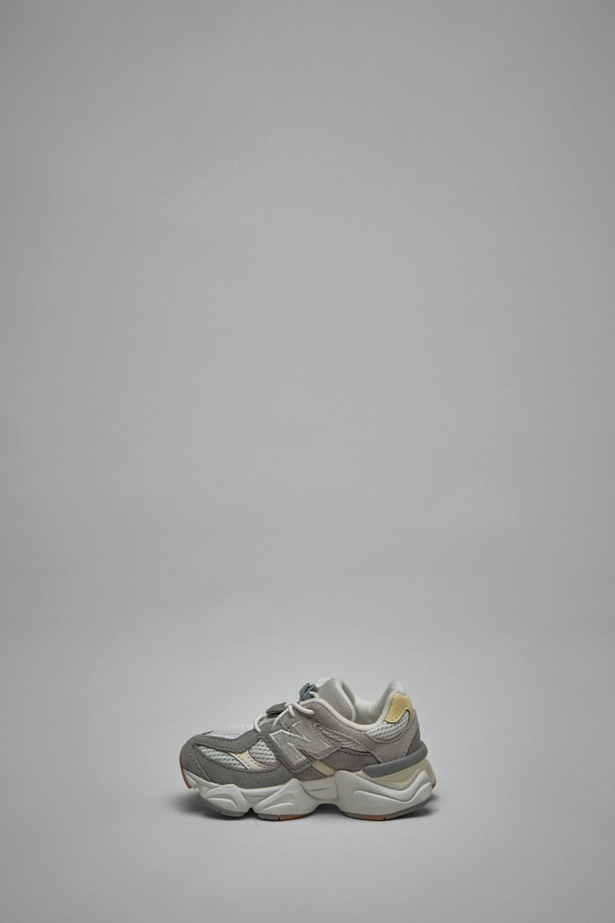 New Balance kids sneakers sole view displaying textured rubber outsole pattern