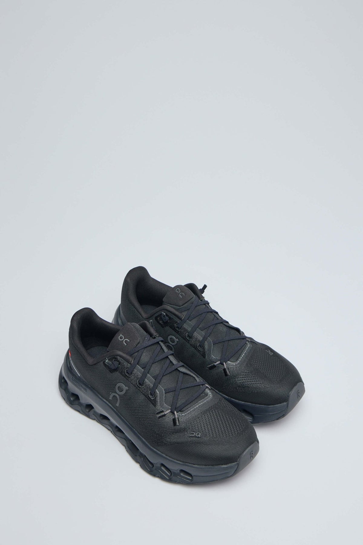 Side view of ON Running Cloudtilt 1 showing recycled mesh upper and signature sole