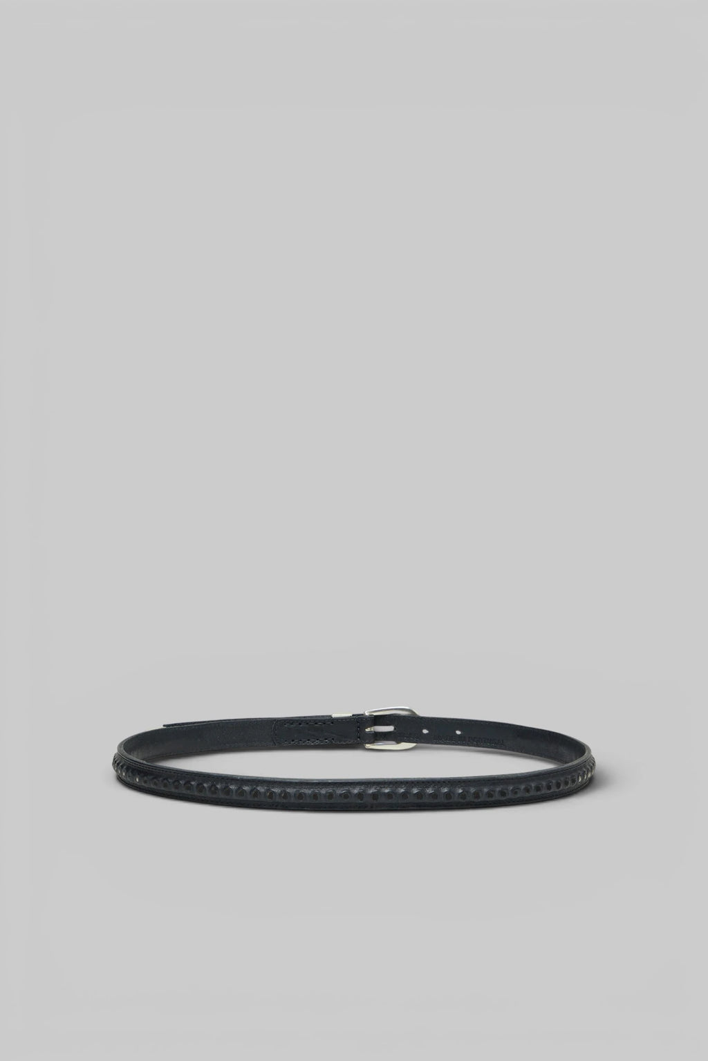 Close-up of the textured leather and stitch detailing on the Our Legacy Bullet Chain Belt