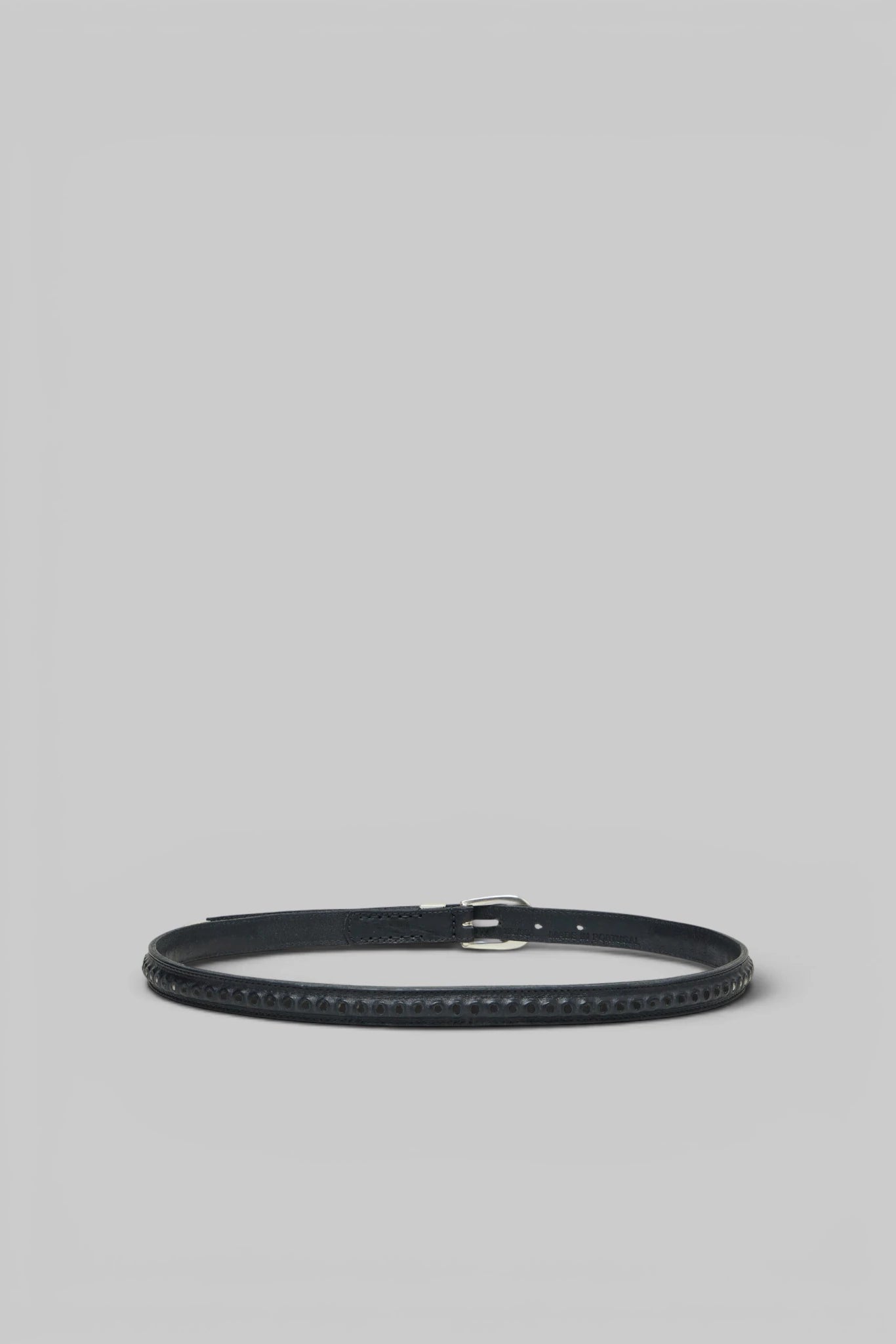 Close-up of the textured leather and stitch detailing on the Our Legacy Bullet Chain Belt