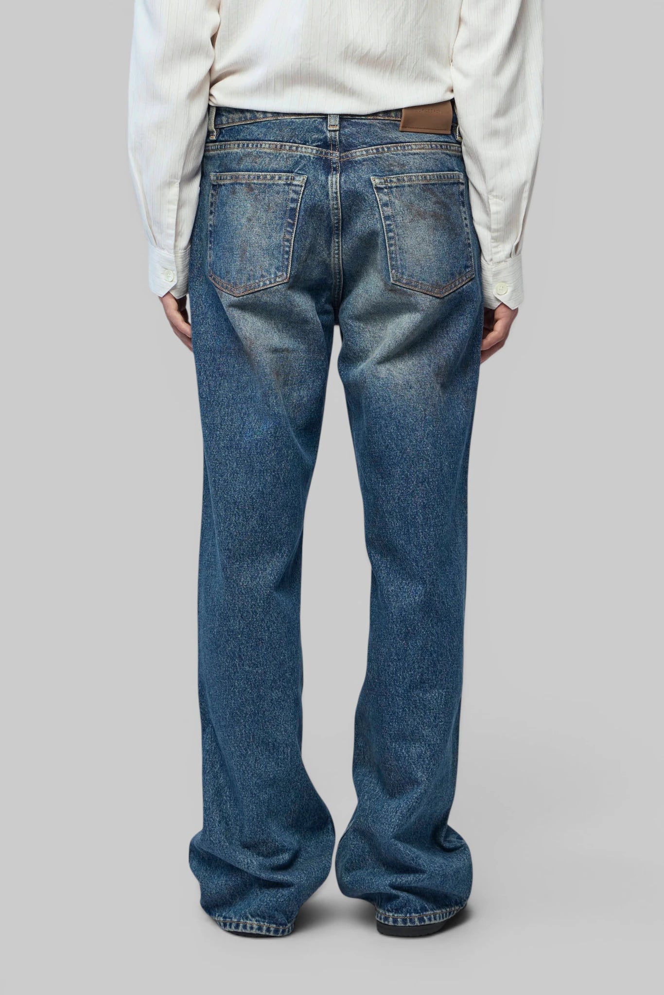 Detail shot of faded denim texture on Our Legacy Carlson Cut jeans
