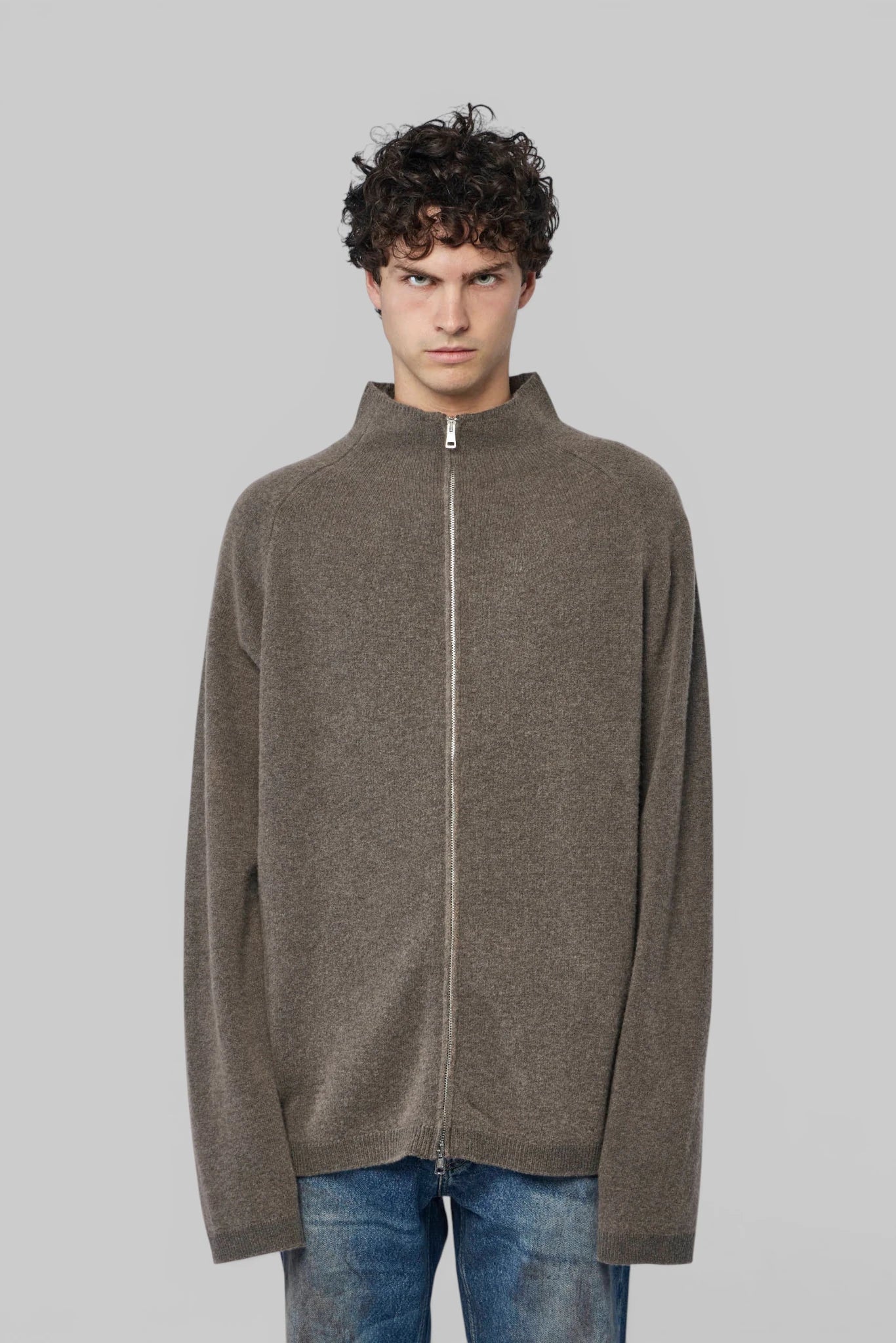Close-up of front zipper on Our Legacy merino wool cardigan