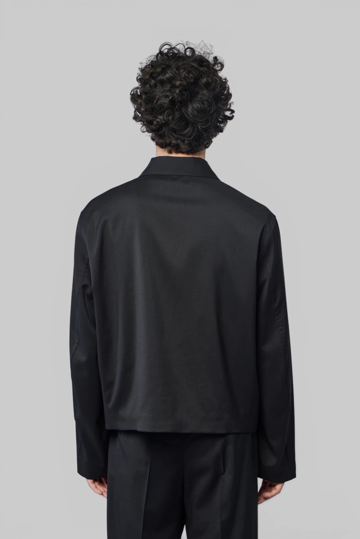 Back view of the Our Legacy Mini Jacket silhouette