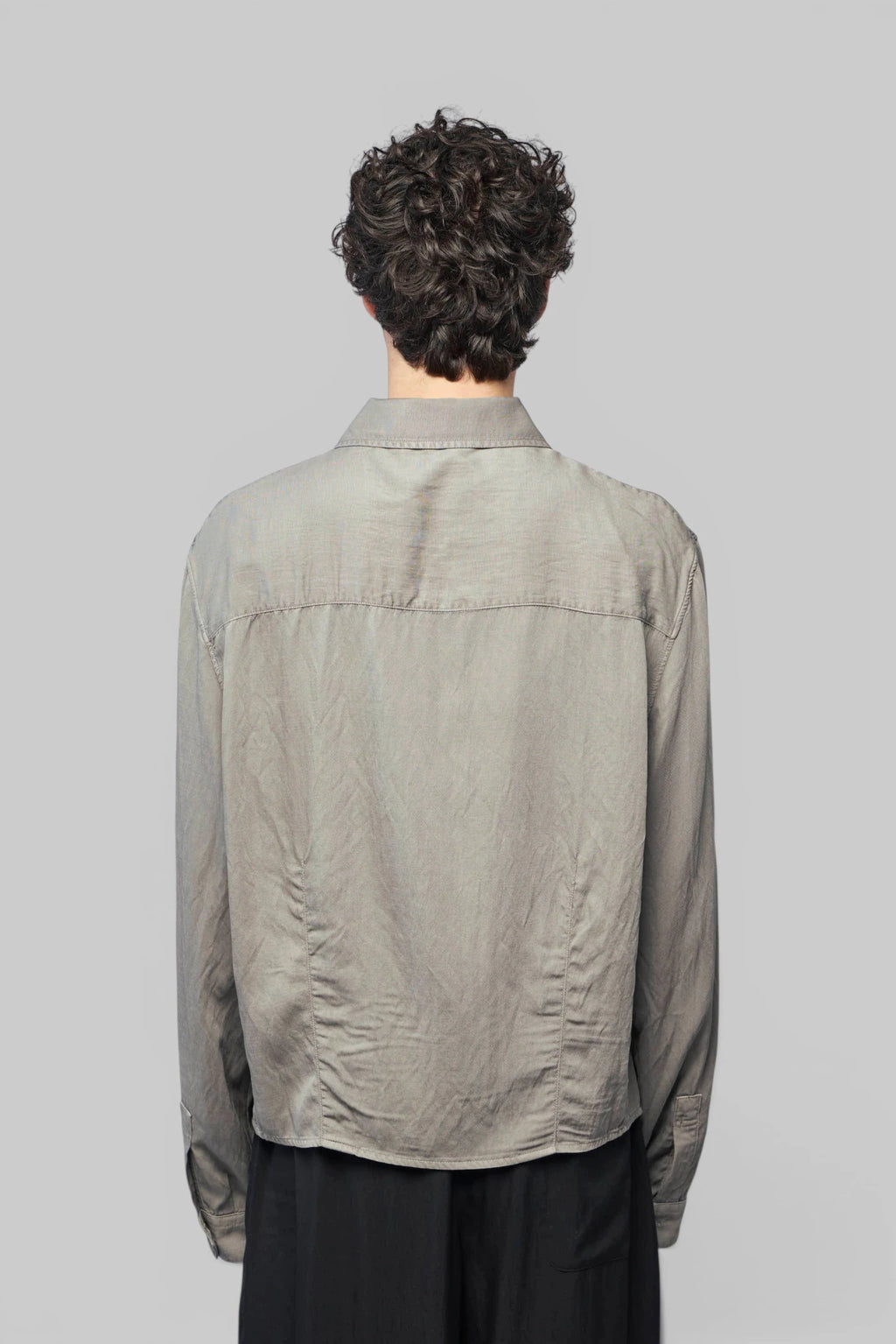 Back view of Our Legacy Sift Zip Shirt with straight hemline