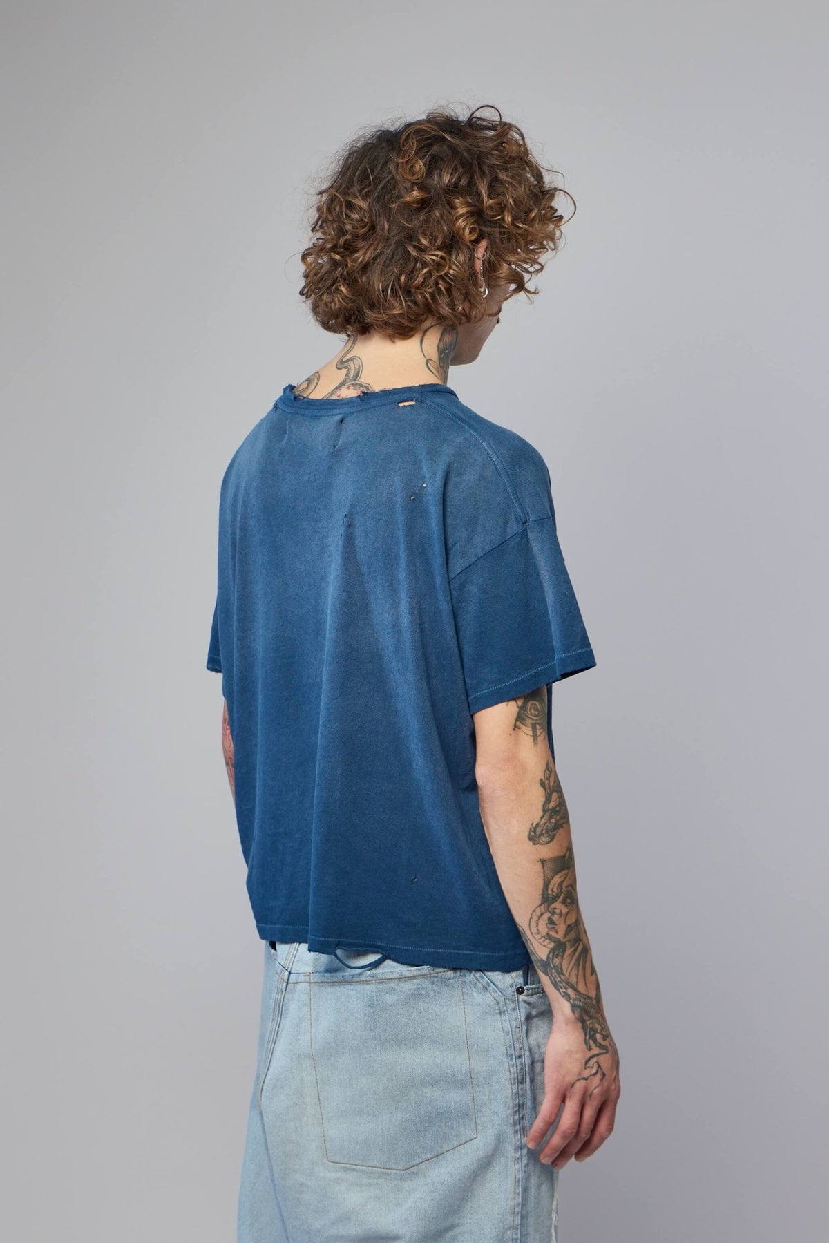 Close-up of premium cotton fabric texture on Bound Glory Tee