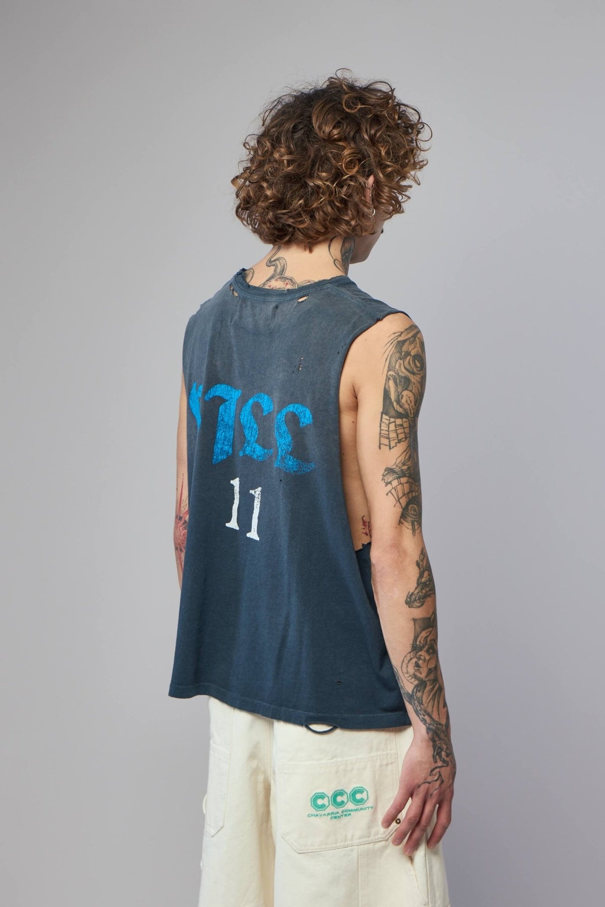 Flat lay styling of Paly Hollywood cotton t-shirt with modern cut-off details