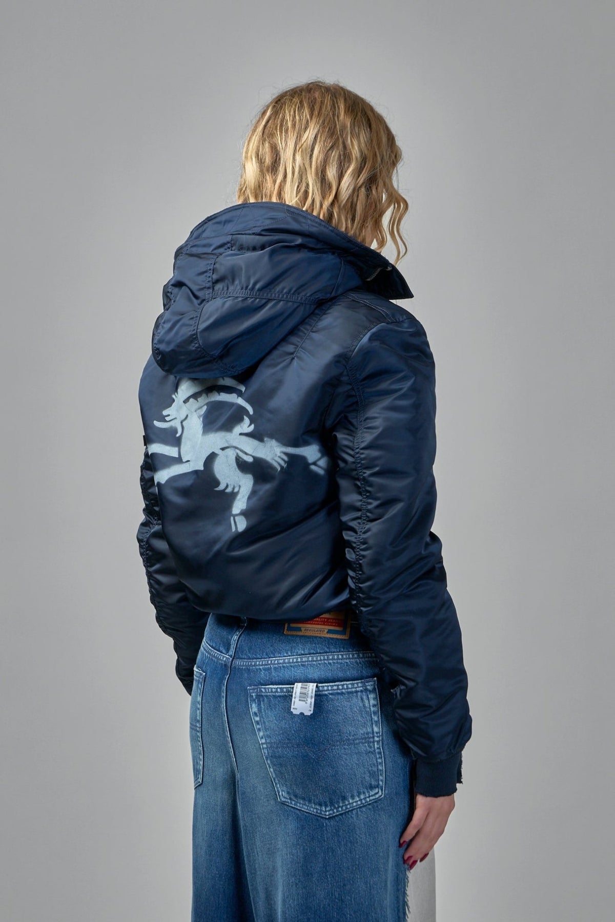 Model wearing Prototypes navy bomber jacket with casual styling, view 10