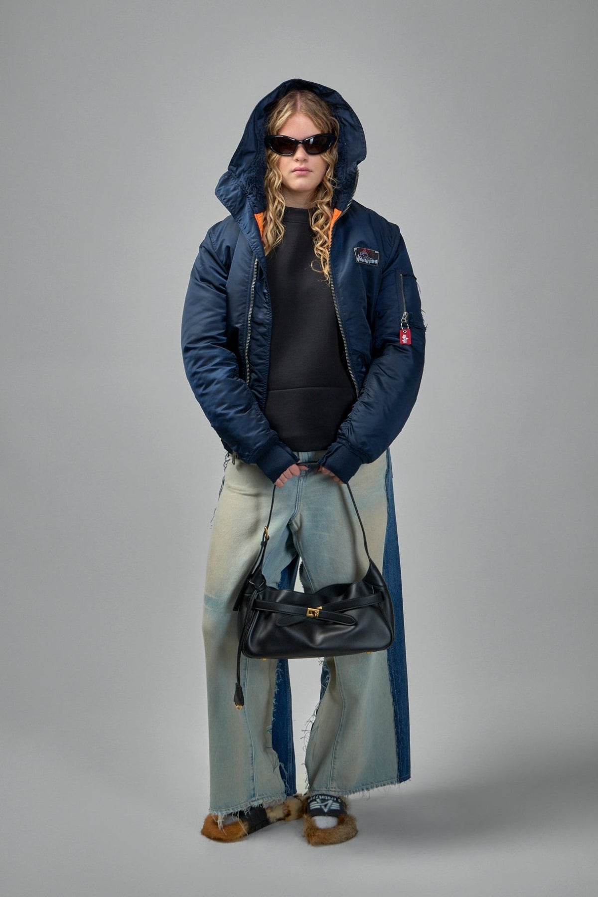 Model wearing Prototypes navy bomber jacket with casual styling, view 13