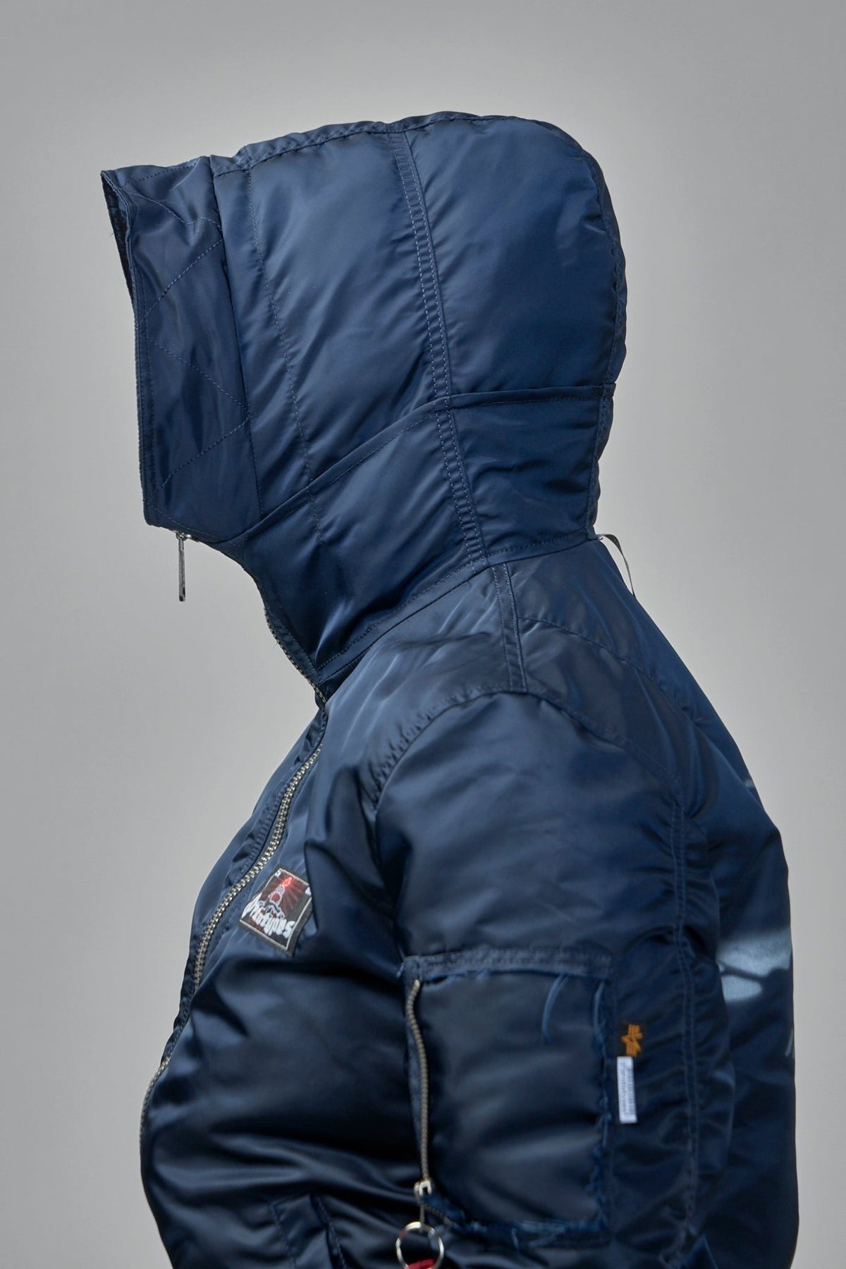 Model wearing Prototypes navy bomber jacket with casual styling, view 12