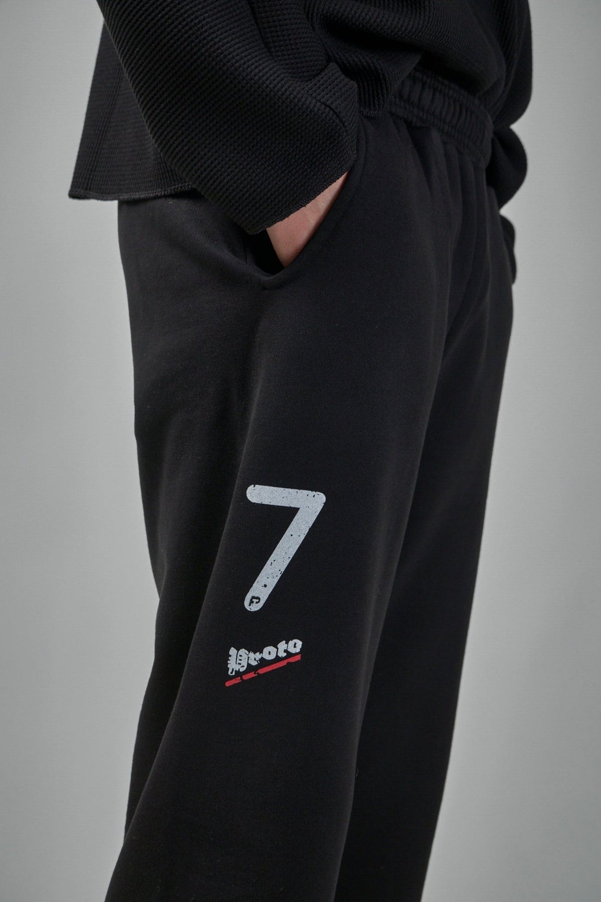 Side view of cropped sweatpants highlighting the ankle-length cut, view 9