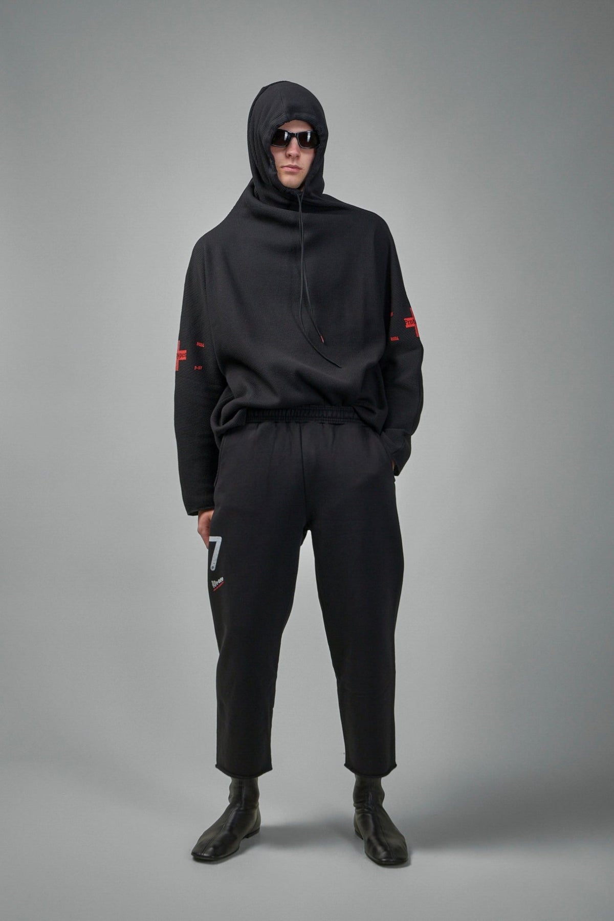 Side view of cropped sweatpants highlighting the ankle-length cut, view 6