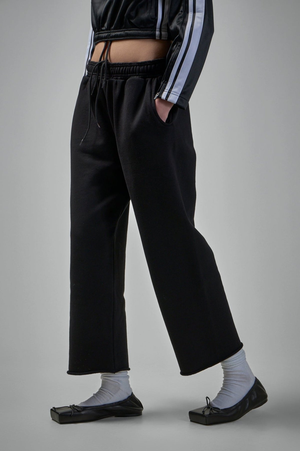 Side view of cropped sweatpants highlighting the ankle-length cut