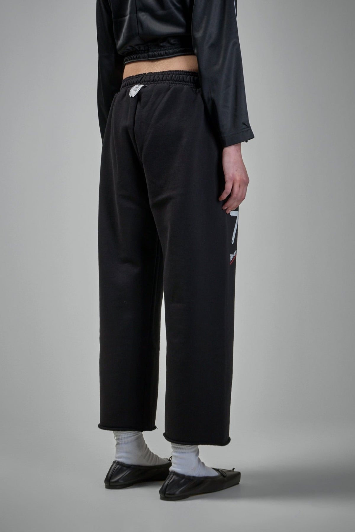 Model wearing Prototypes cropped sweatpants showing relaxed fit