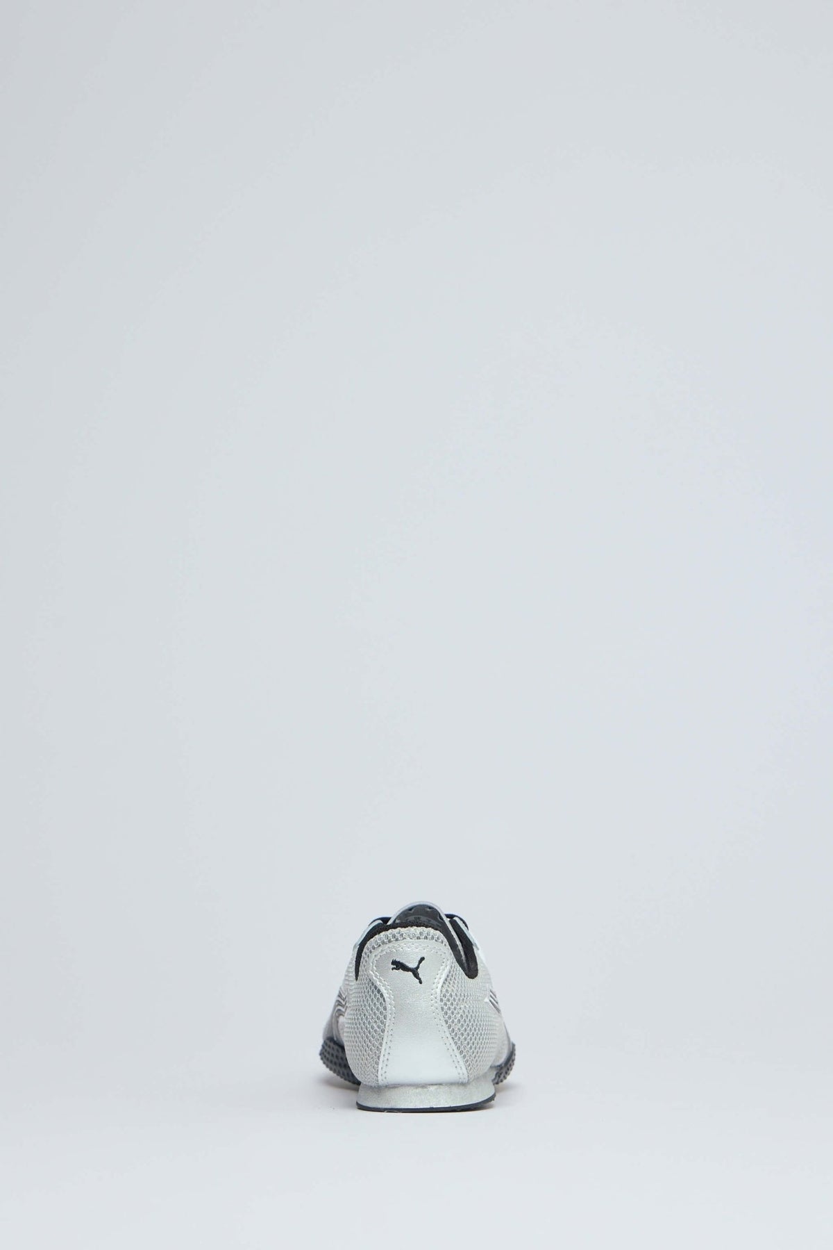 Overhead view of unisex chrome sneakers displaying sleek design