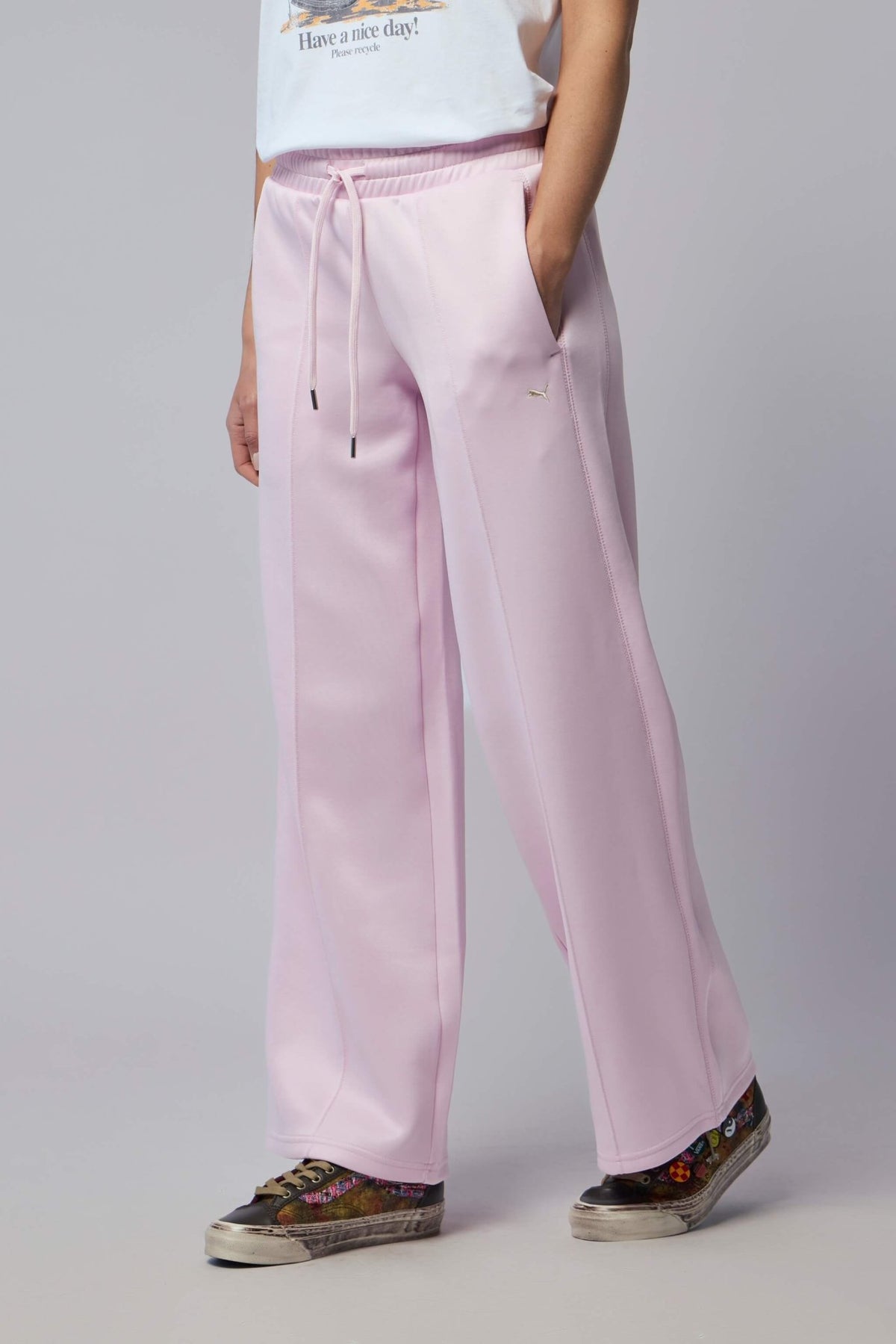 Model wearing Puma wide-leg pants demonstrating the comfortable fit and silhouette