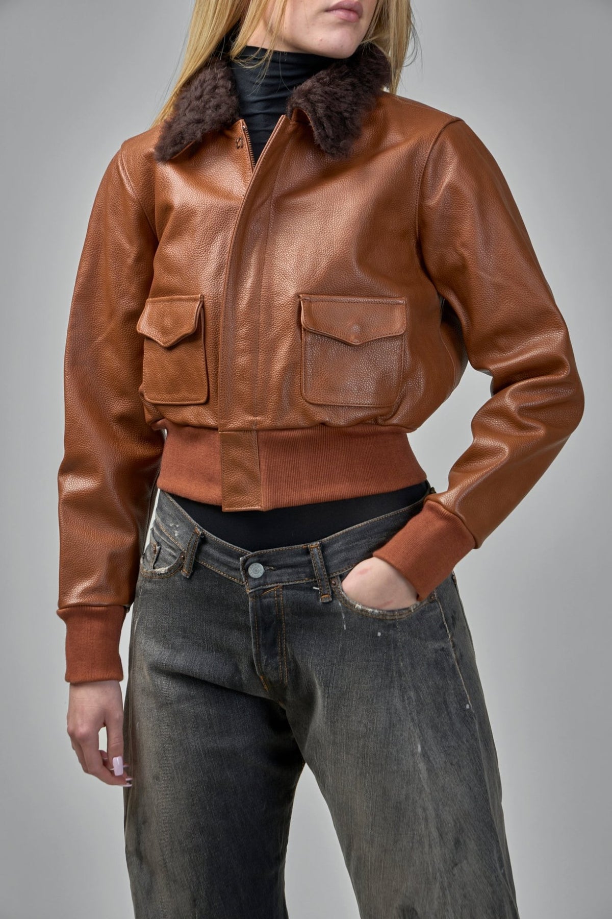 Detail shot of dark brown shearling collar on R13 leather jacket