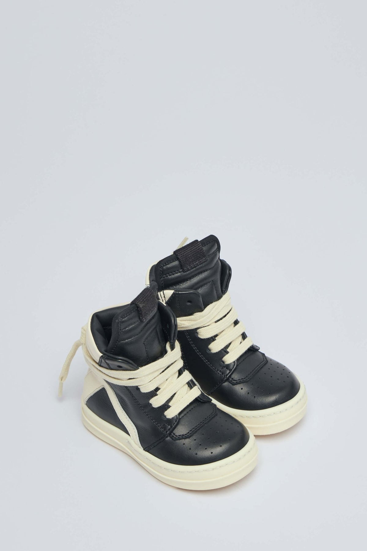 Side view of Rick Owens kids sneakers showing rope lacing detail