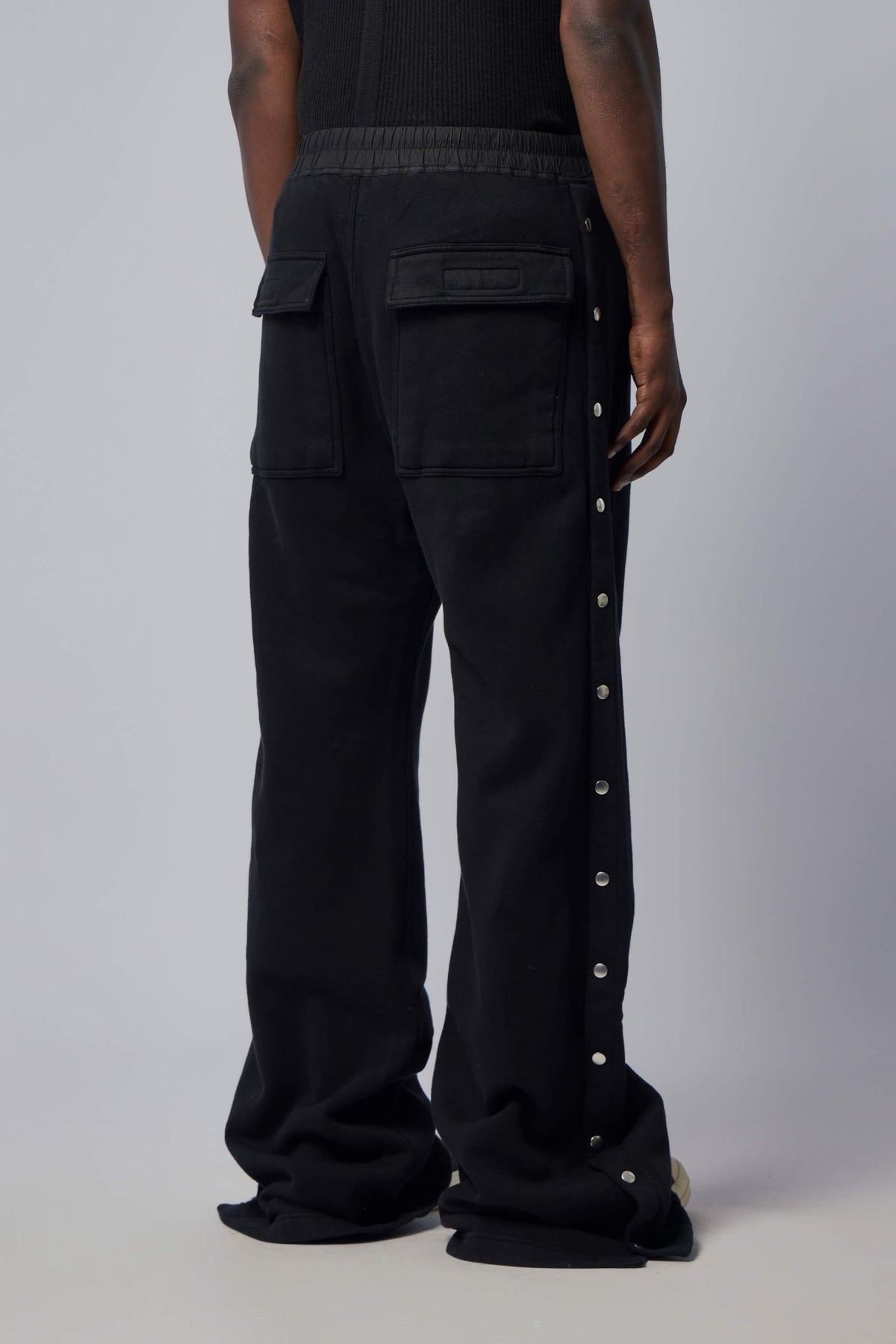 Full-length view of model wearing Rick Owens wide pusher pants