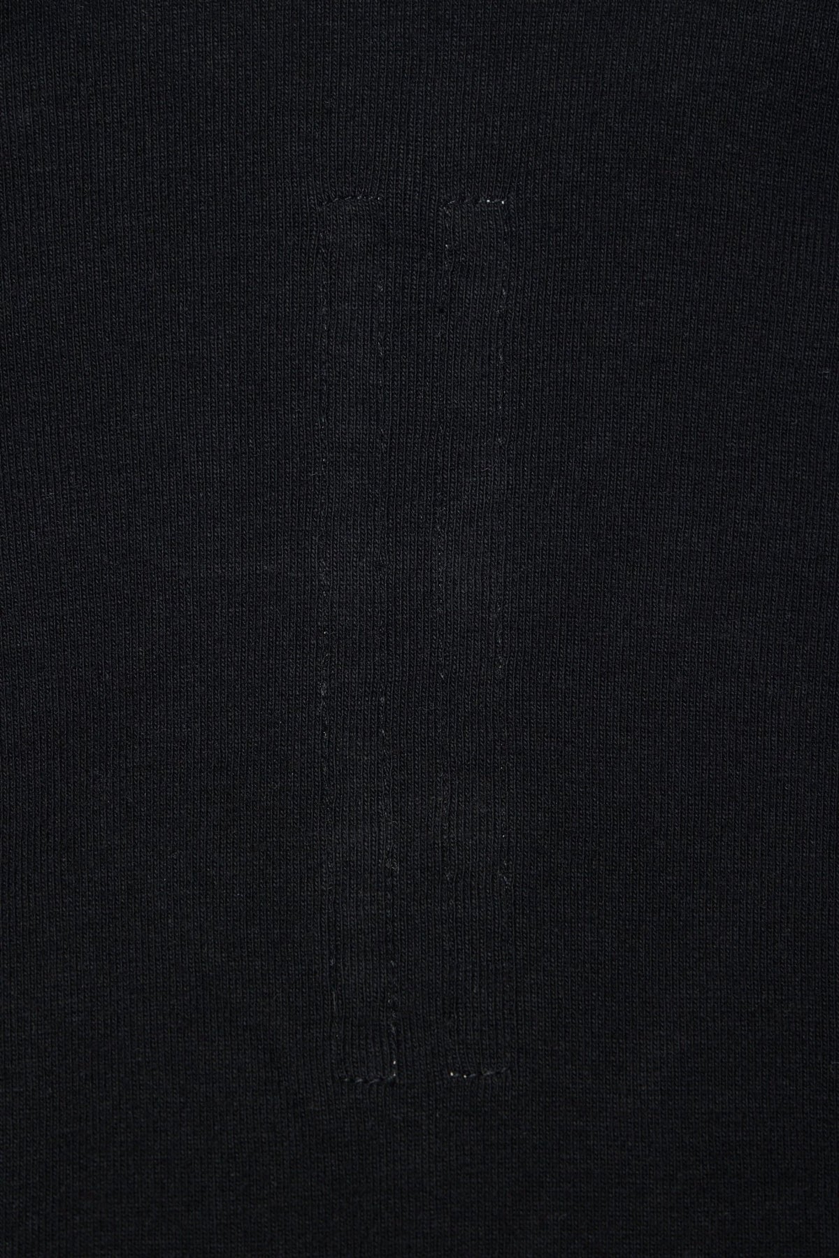 Detail shot of printed text design on Rick Owens Knit Body