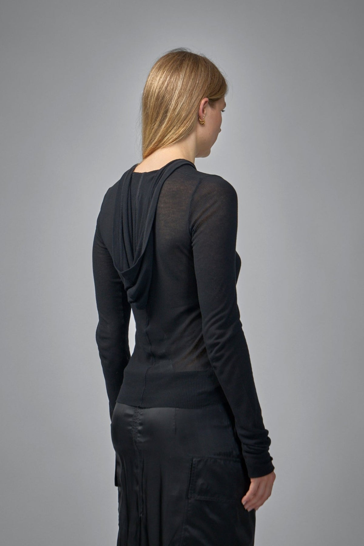 Model wearing Rick Owens cropped hooded tee showing relaxed fit and minimalist design
