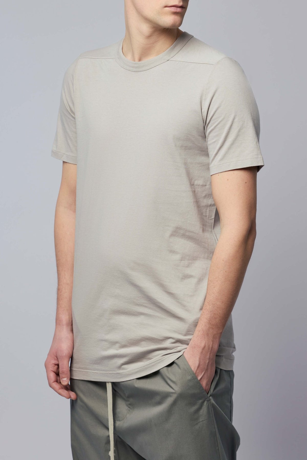 Model wearing Rick Owens Knit T-shirt - Level T styled with casual bottoms